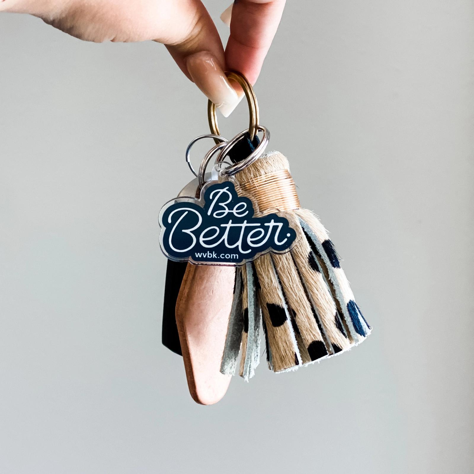 Custom acrylic "Be Better." keychain.
