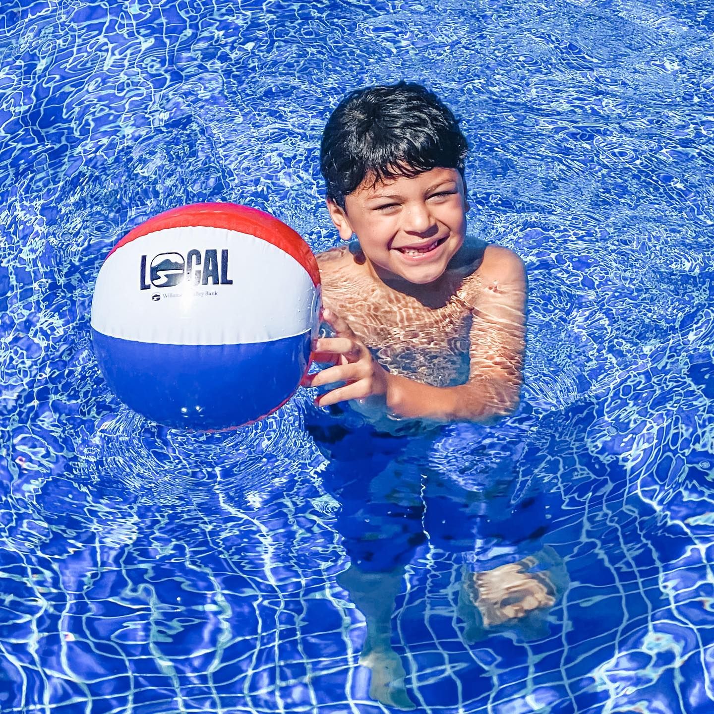 Pool day with custom beach ball.
