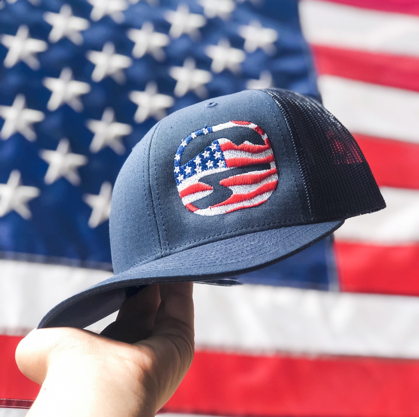 USA flag-themed logo embroidered trucker hat.