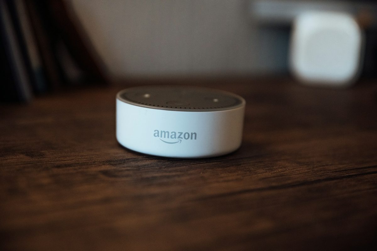 A white Amazon Echo Dot