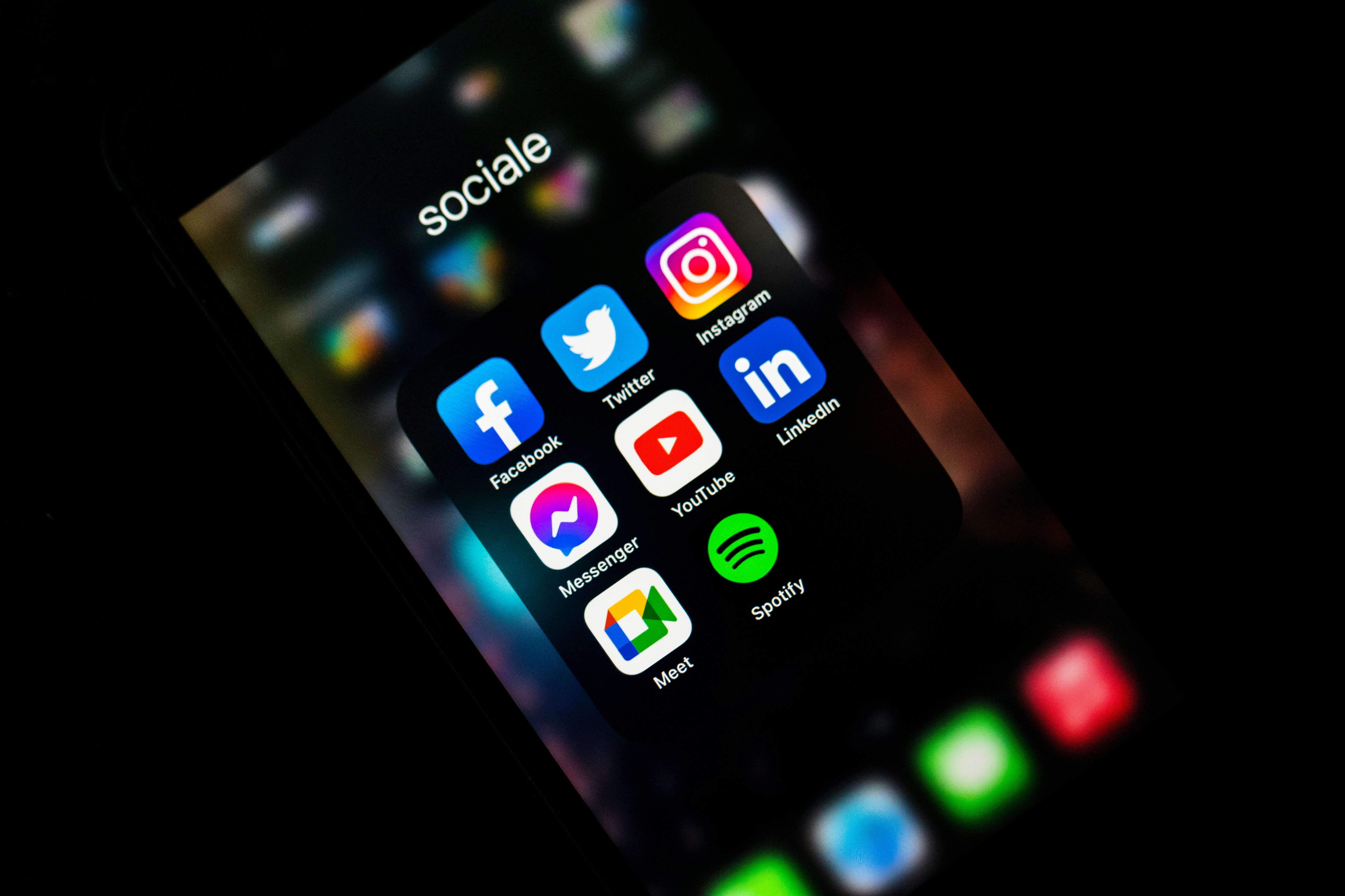 Main Image: iPhone screen with several social media icons