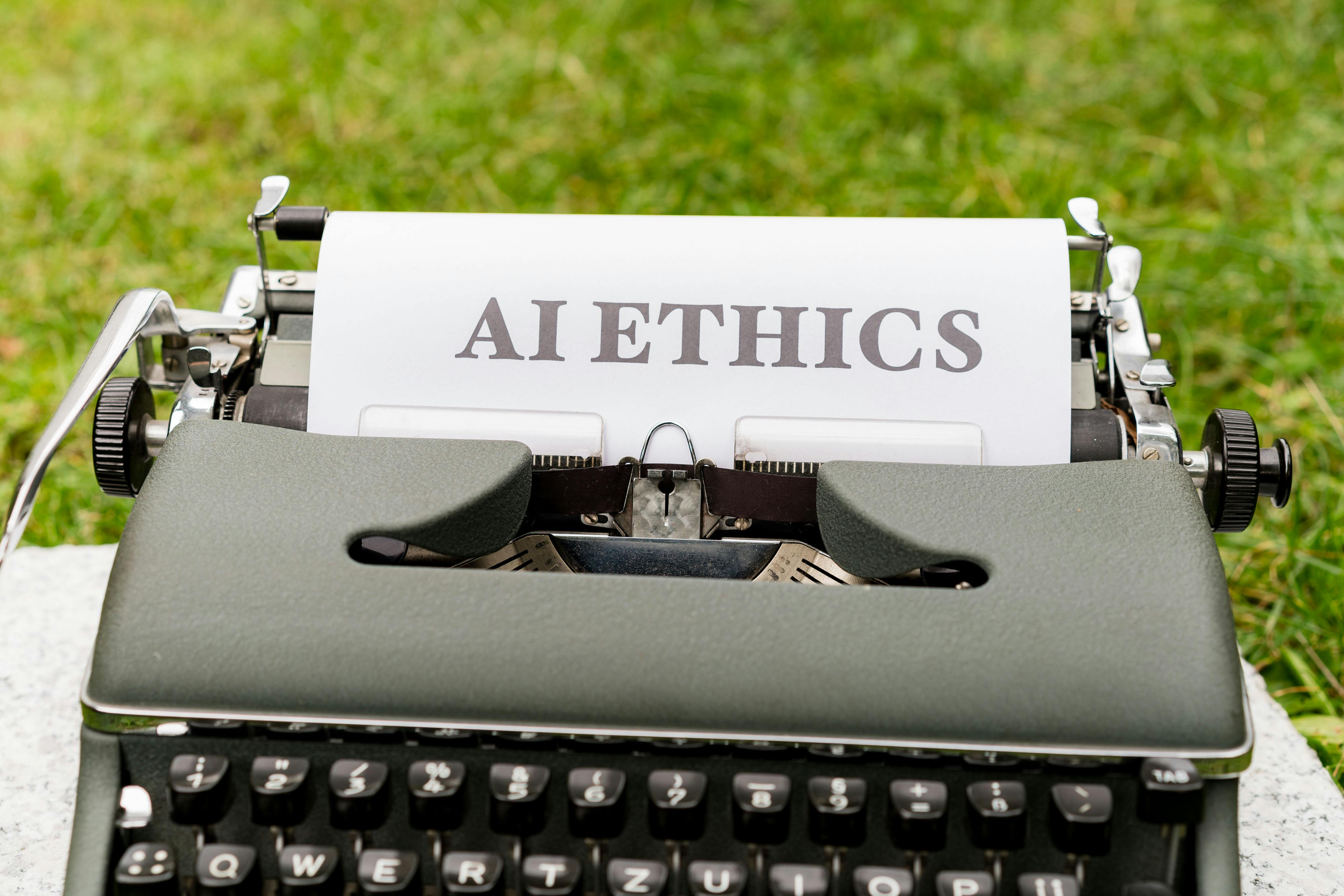 Main Image: A typewriter written 'AI Ethics' on it.