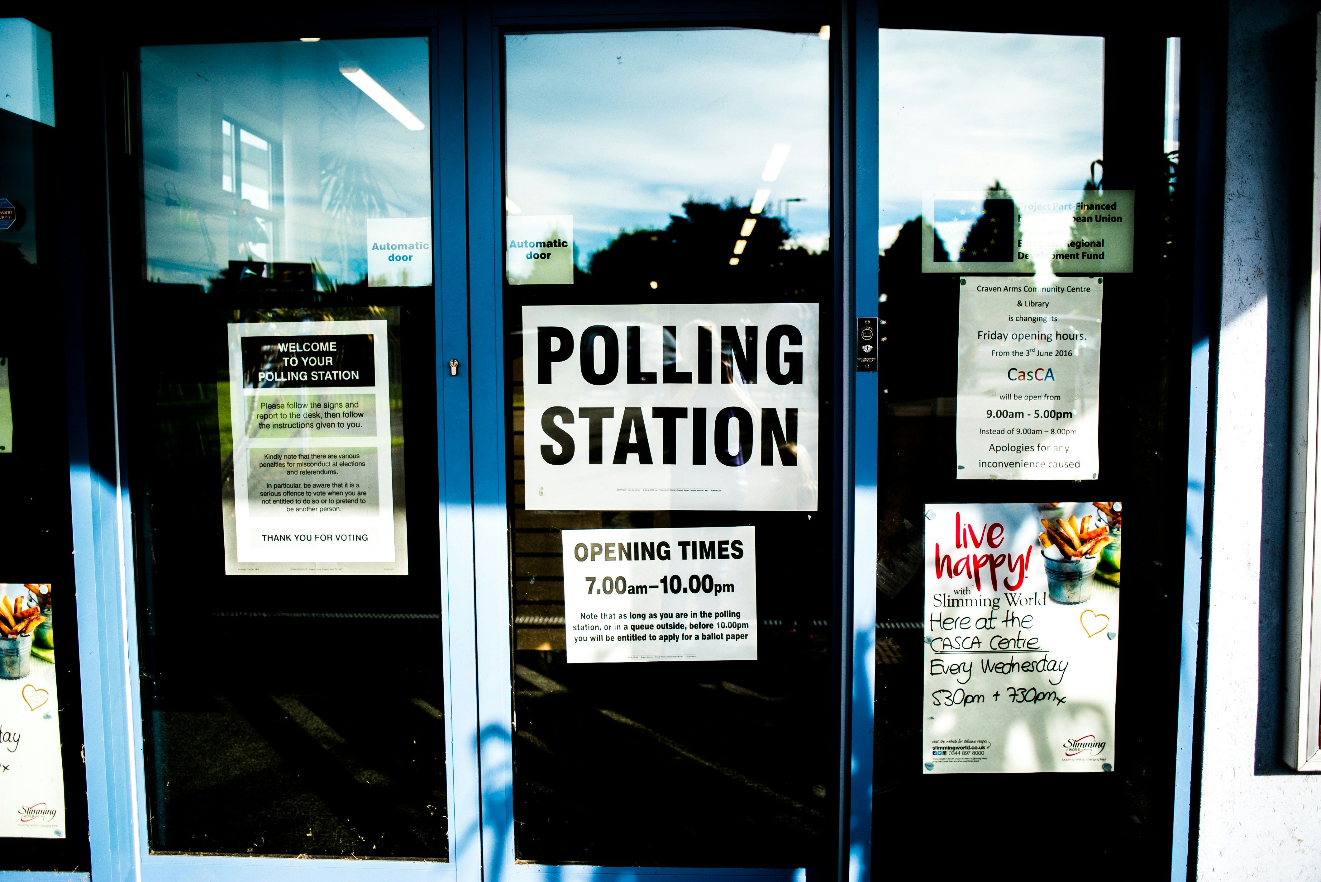 'Polling Station' written on a glass door.