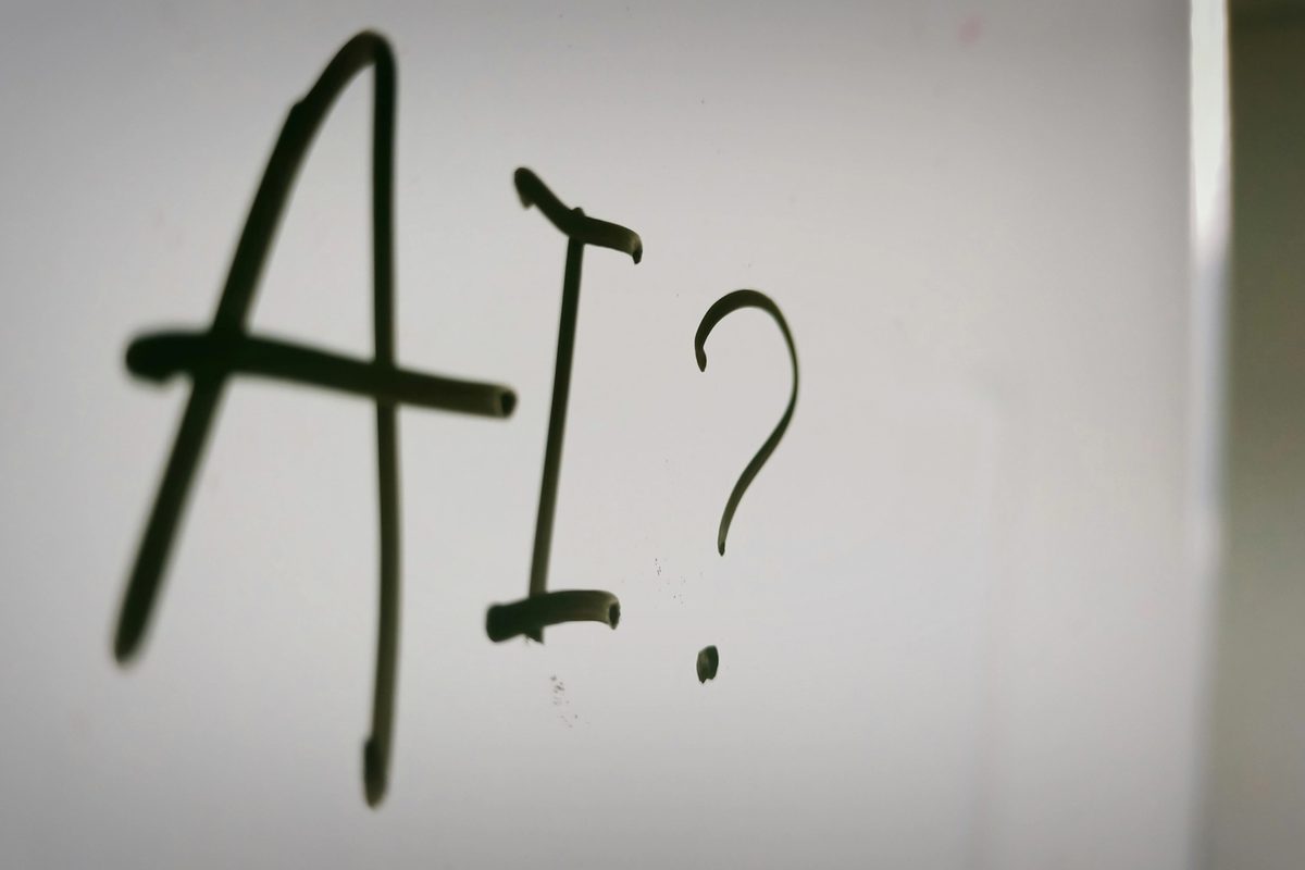 A sign written "AI?" on it