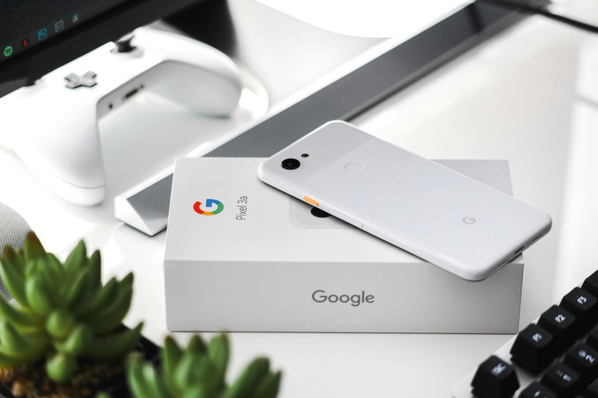 White Google phone with package box beneath it.