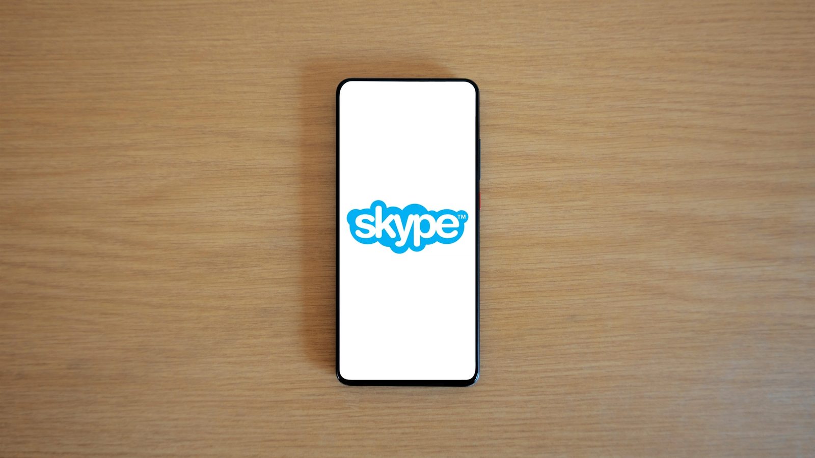 Main Image: Skype logo on a smartphone
