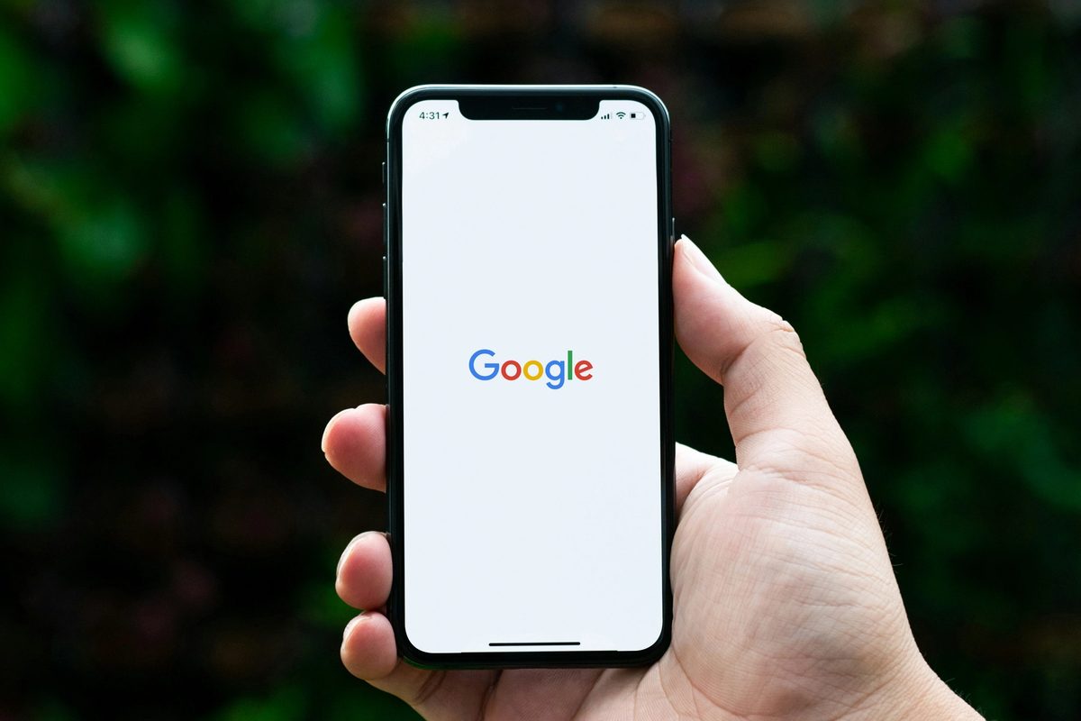 Black phone with google search app in use