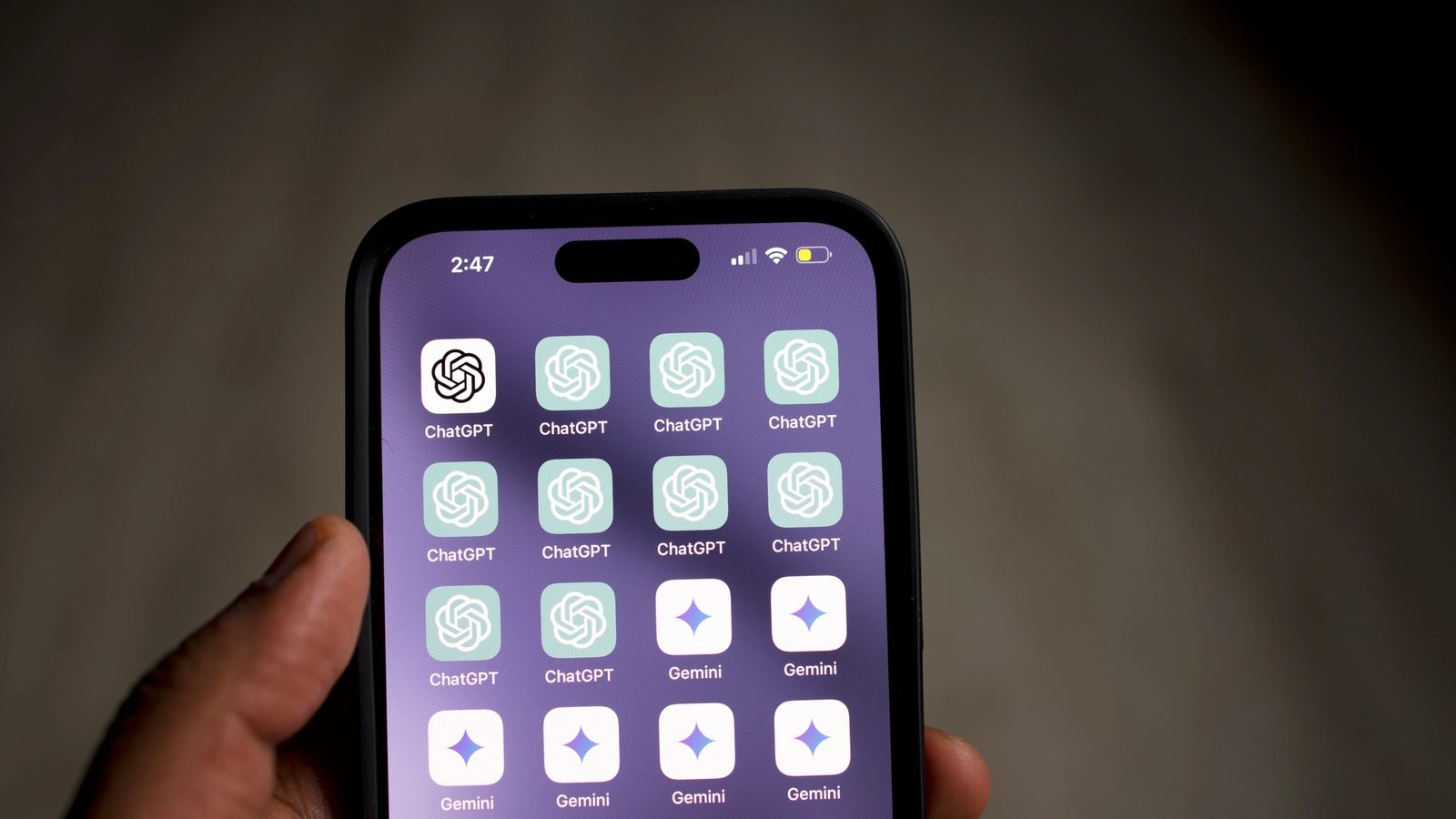 Main Image: Image of a phone screen with various AI app logos
