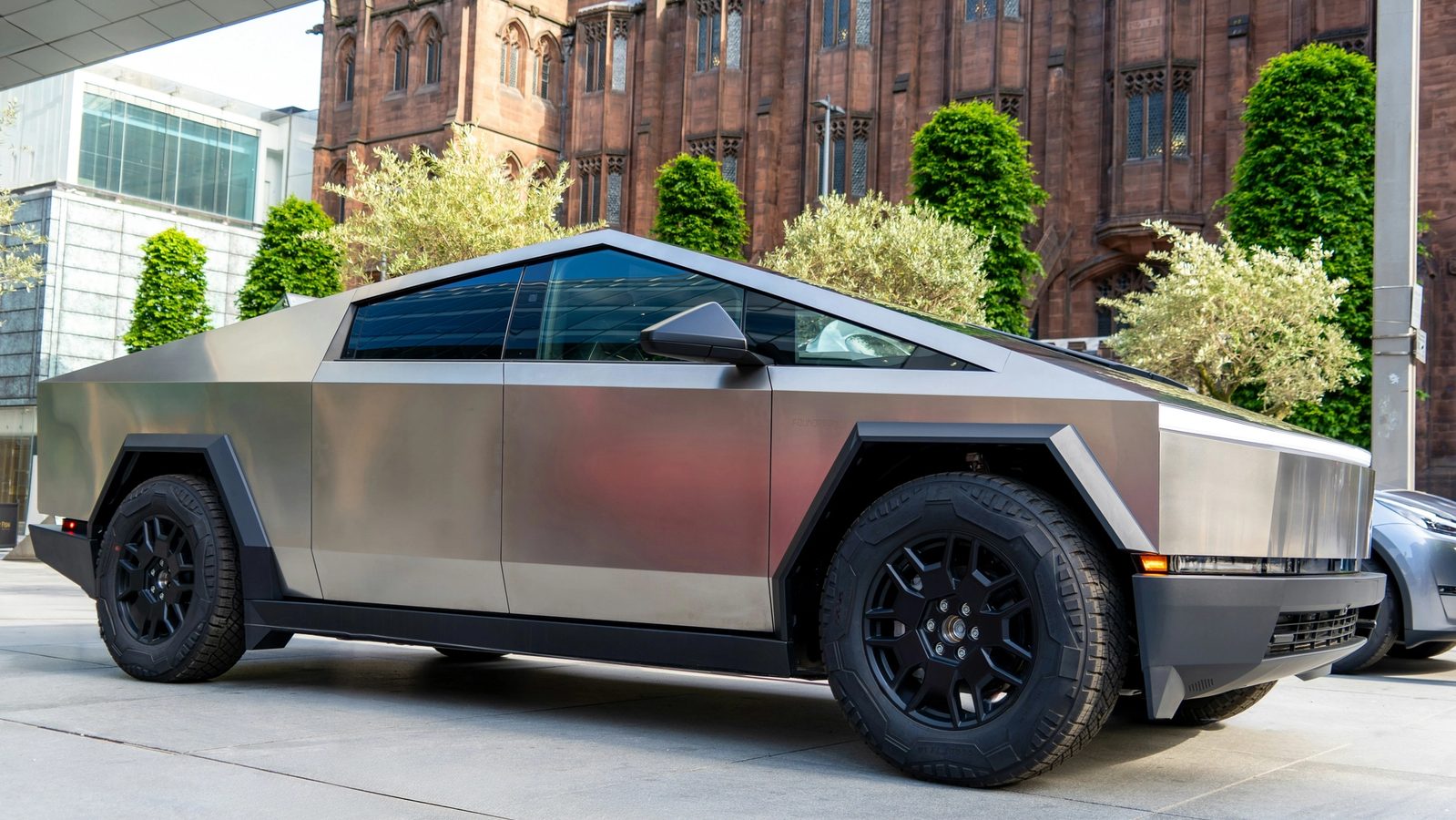Cybertruck parked in front of a building in Manchester, UK
