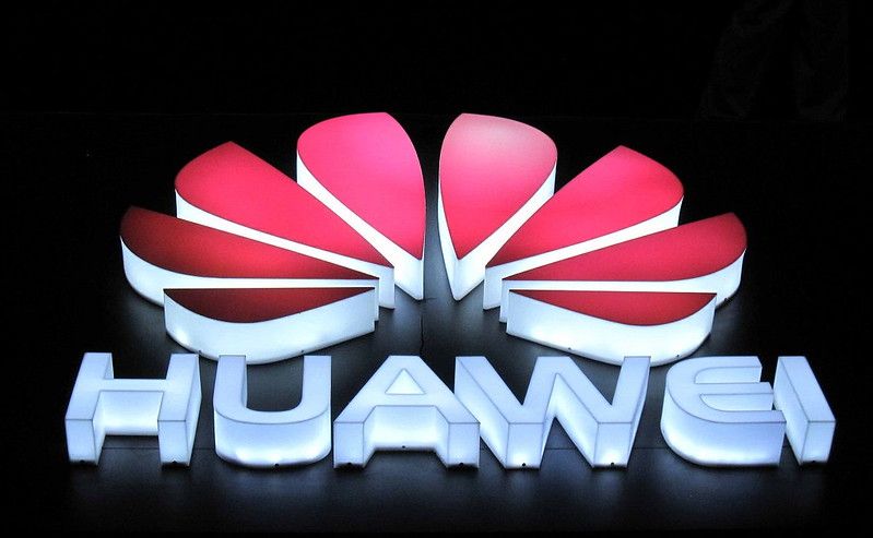 Huawei logo lit up at night