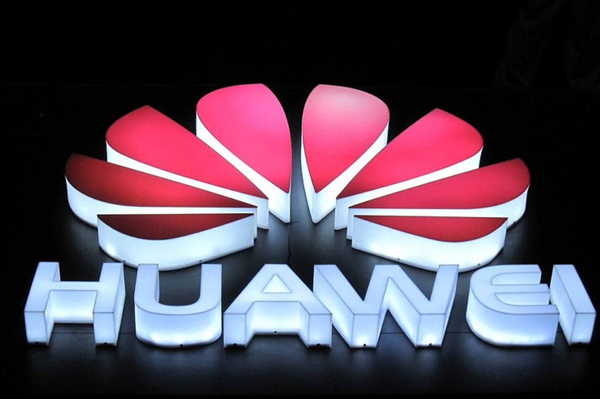 Huawei logo lit up at night