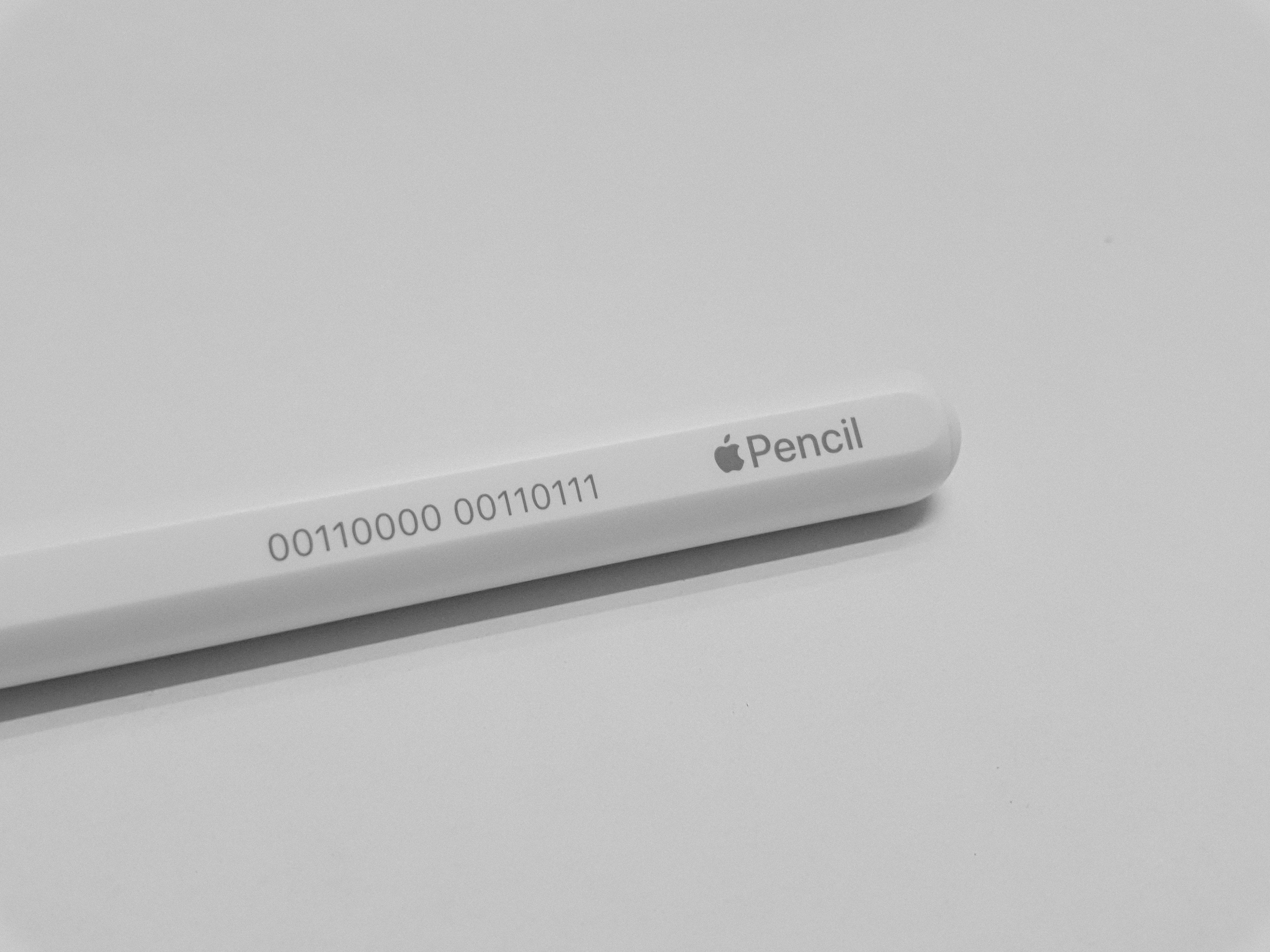A white Apple Pencil on a table