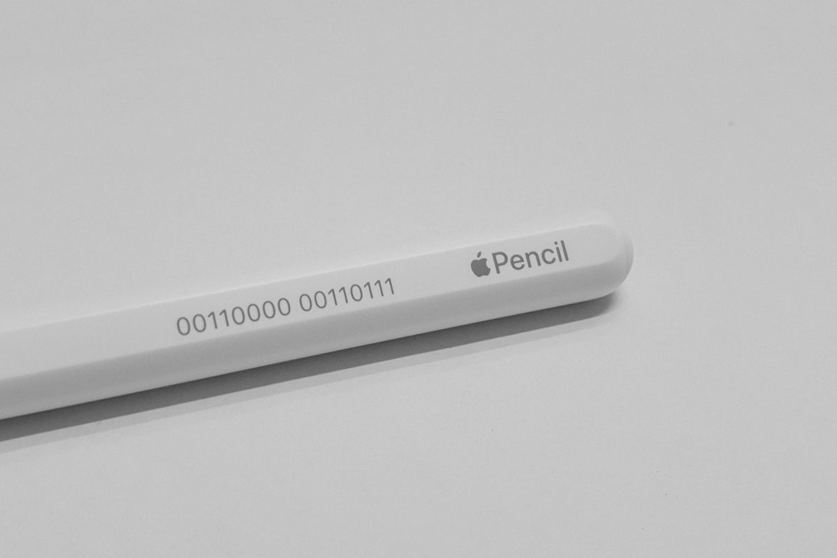 A white Apple Pencil on a table