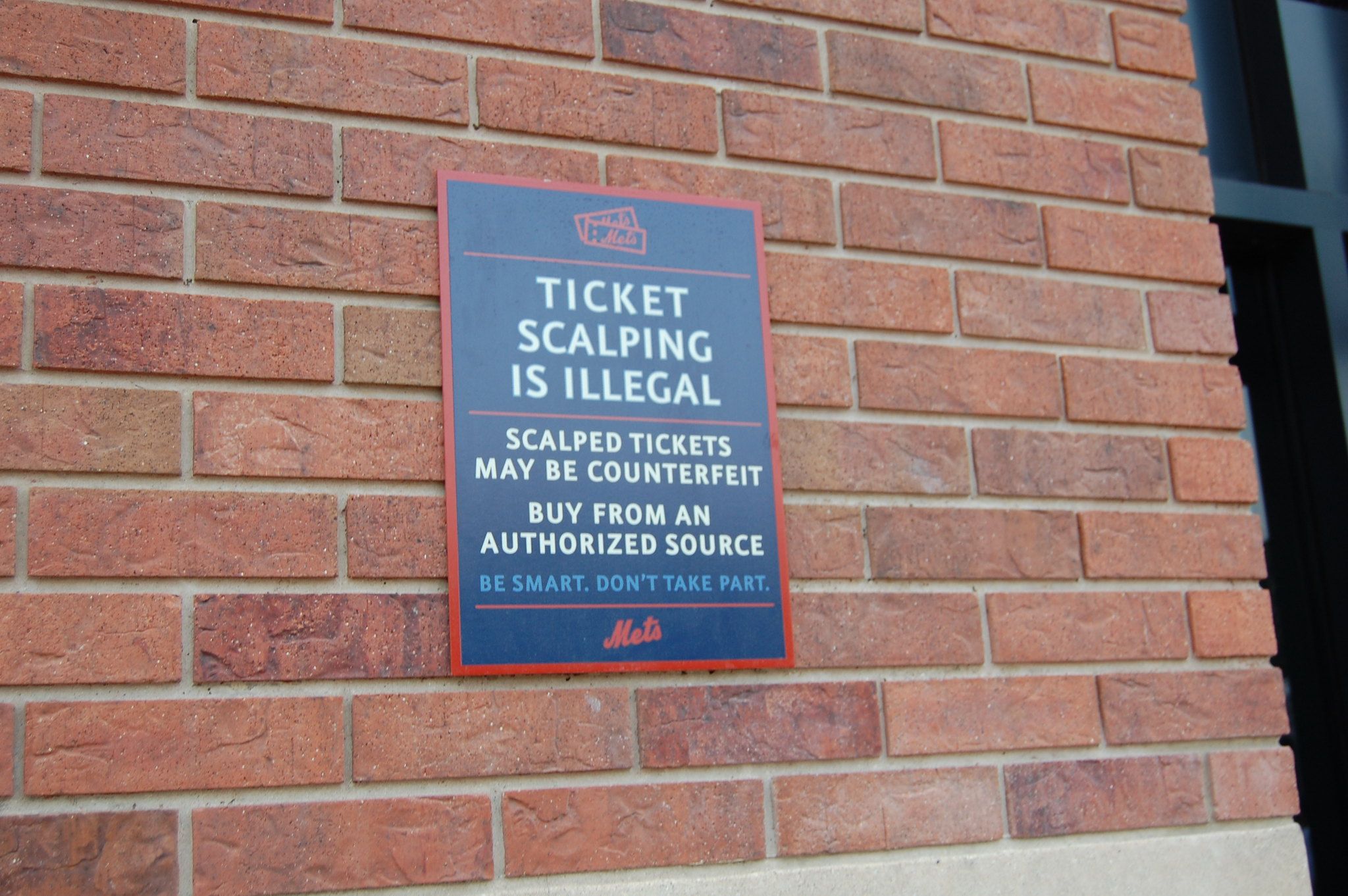 "Ticket Scalping Is Illegal" outside the Mets stadium.