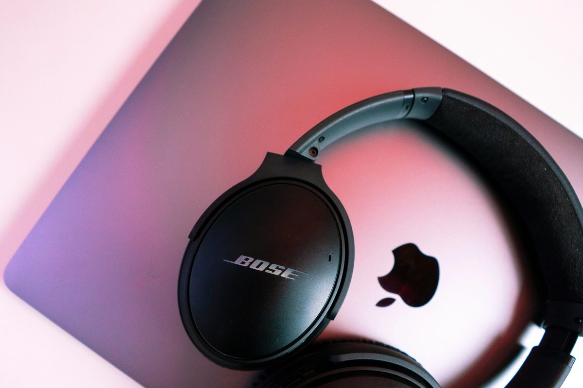 Black sony headphones on pink ipad case