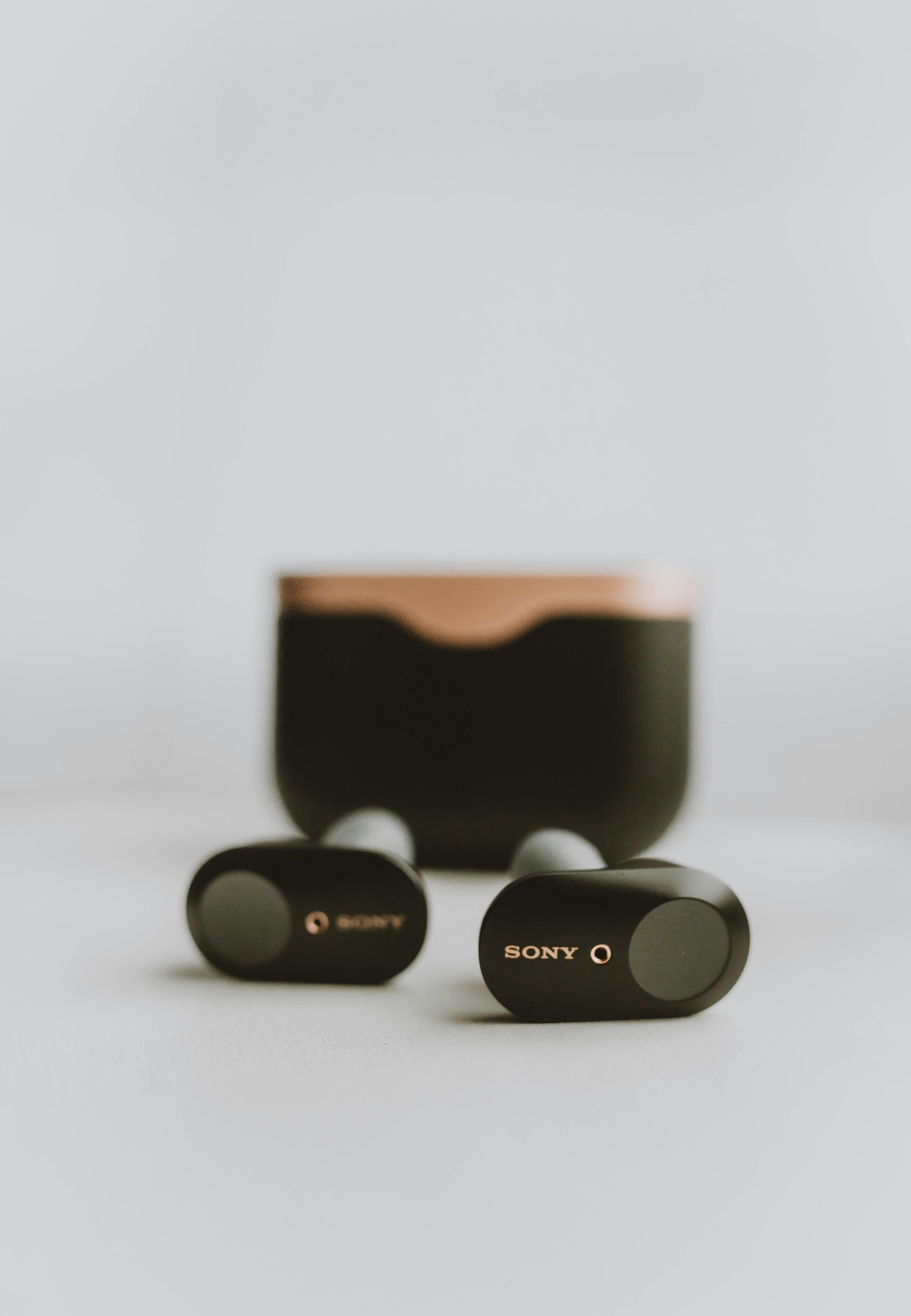 Black and brown Sony earbuds