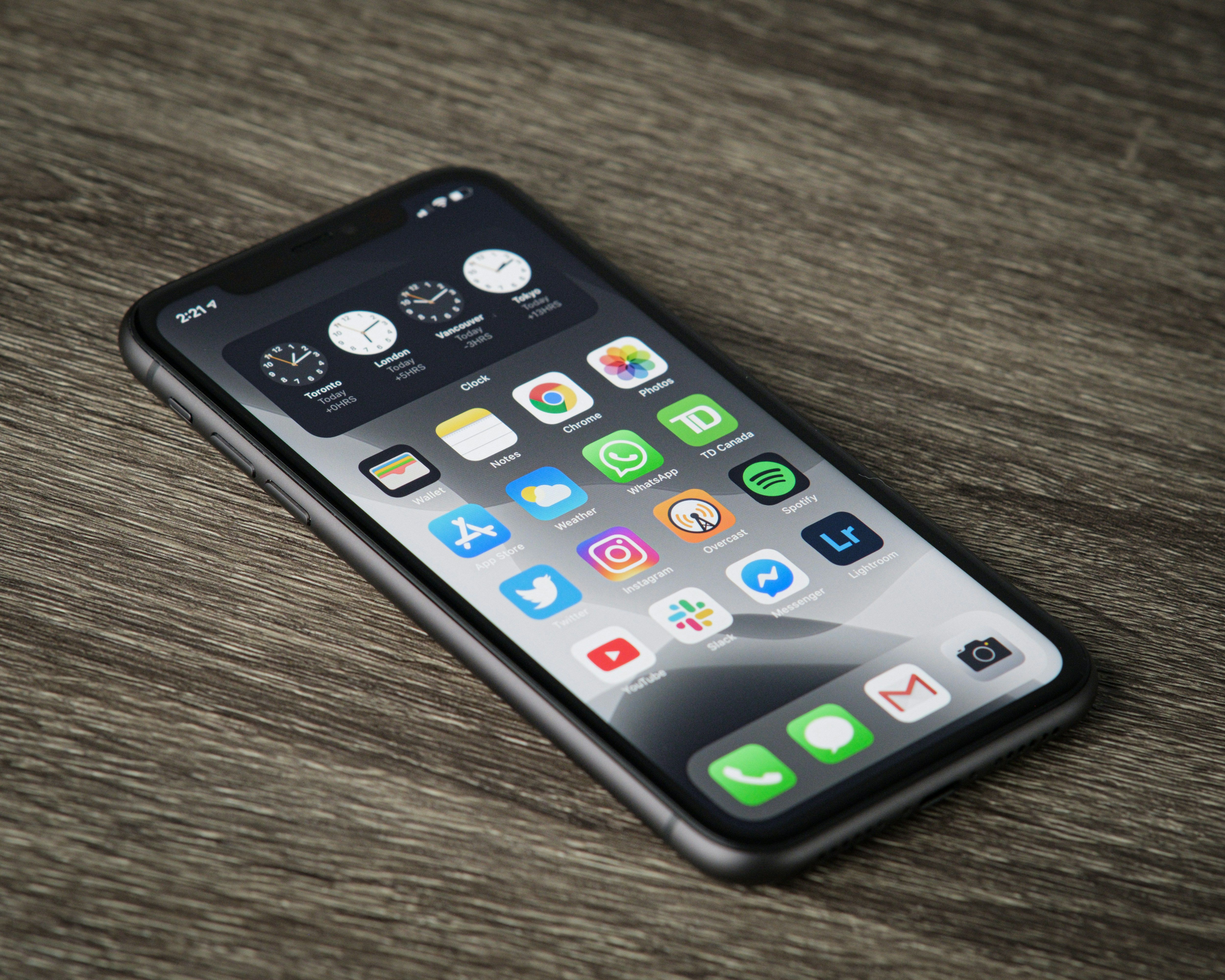 Black iPhone on a wooden table