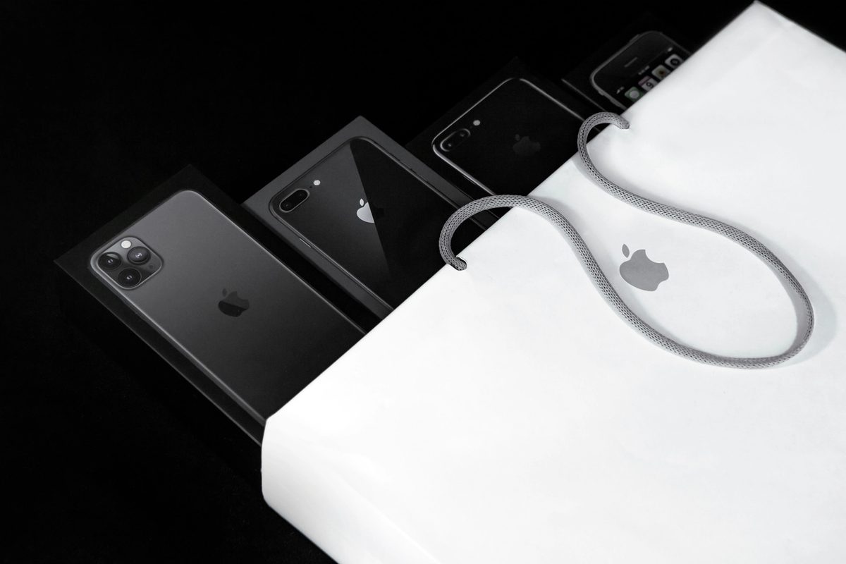 Several Apple products inside an Apple bag