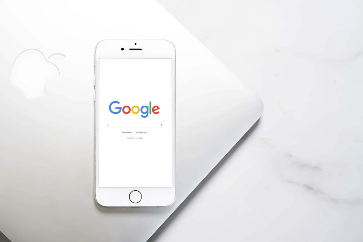 A white mobile phone with Google Search