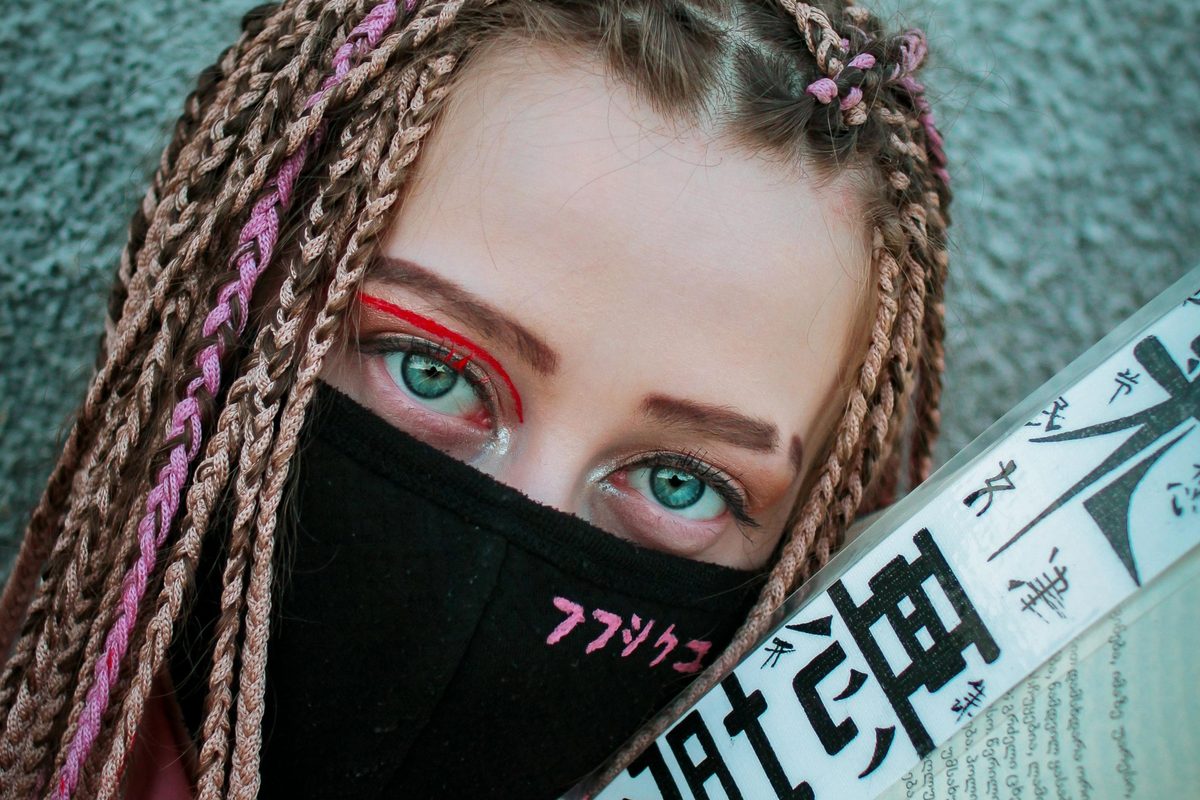 modern woman in safety mask with book