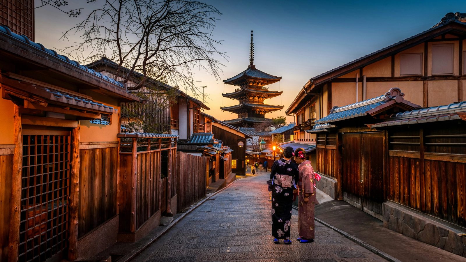 Main Image: Two women in Kimono's standing on a street in Kyoto
