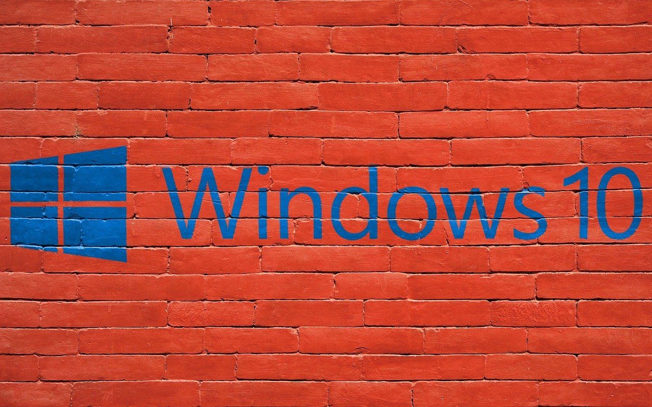 Main image: Windows 10 painted on a red wall.