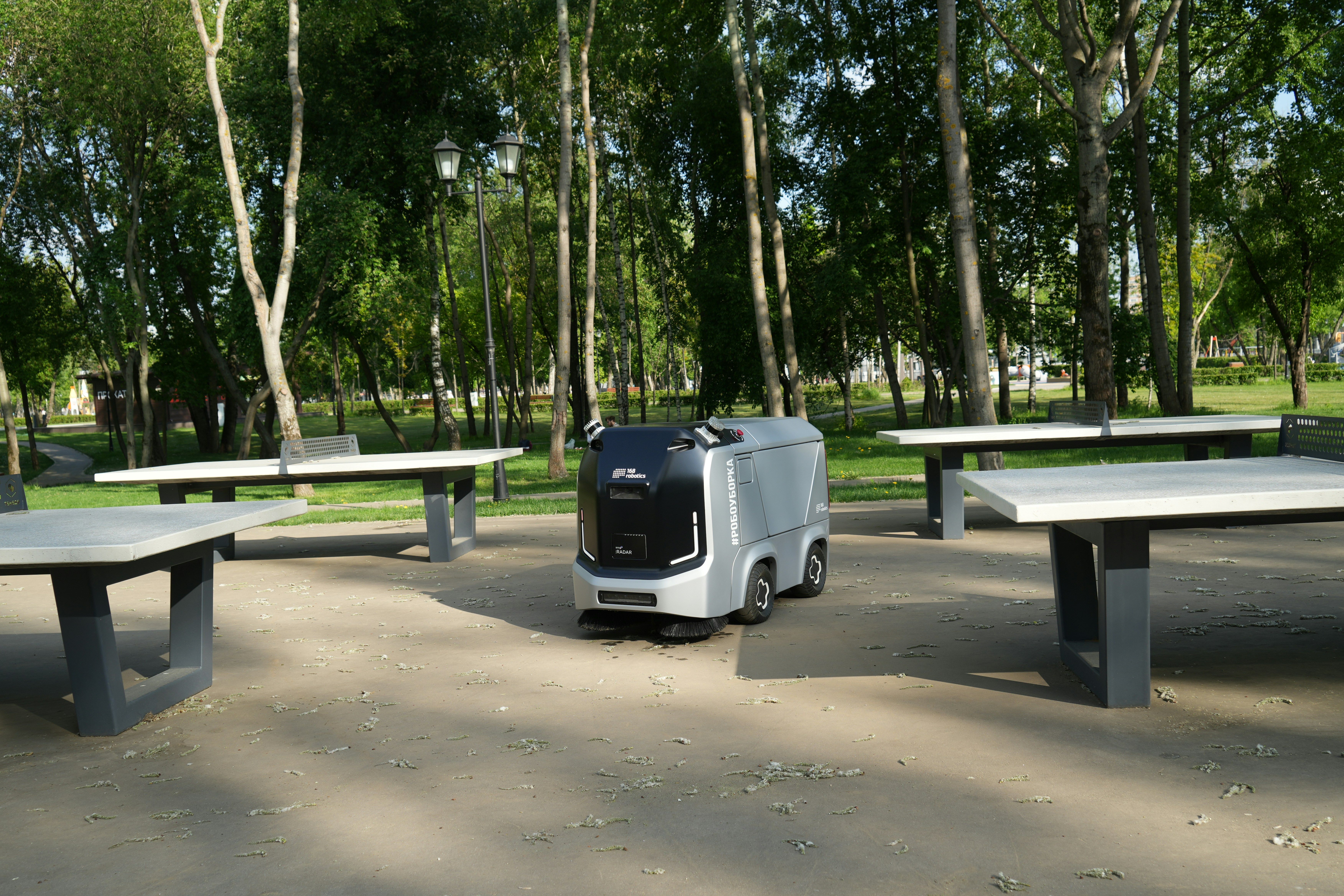 Autonomous robot sweeper cleaning a street in Moscow, Russia