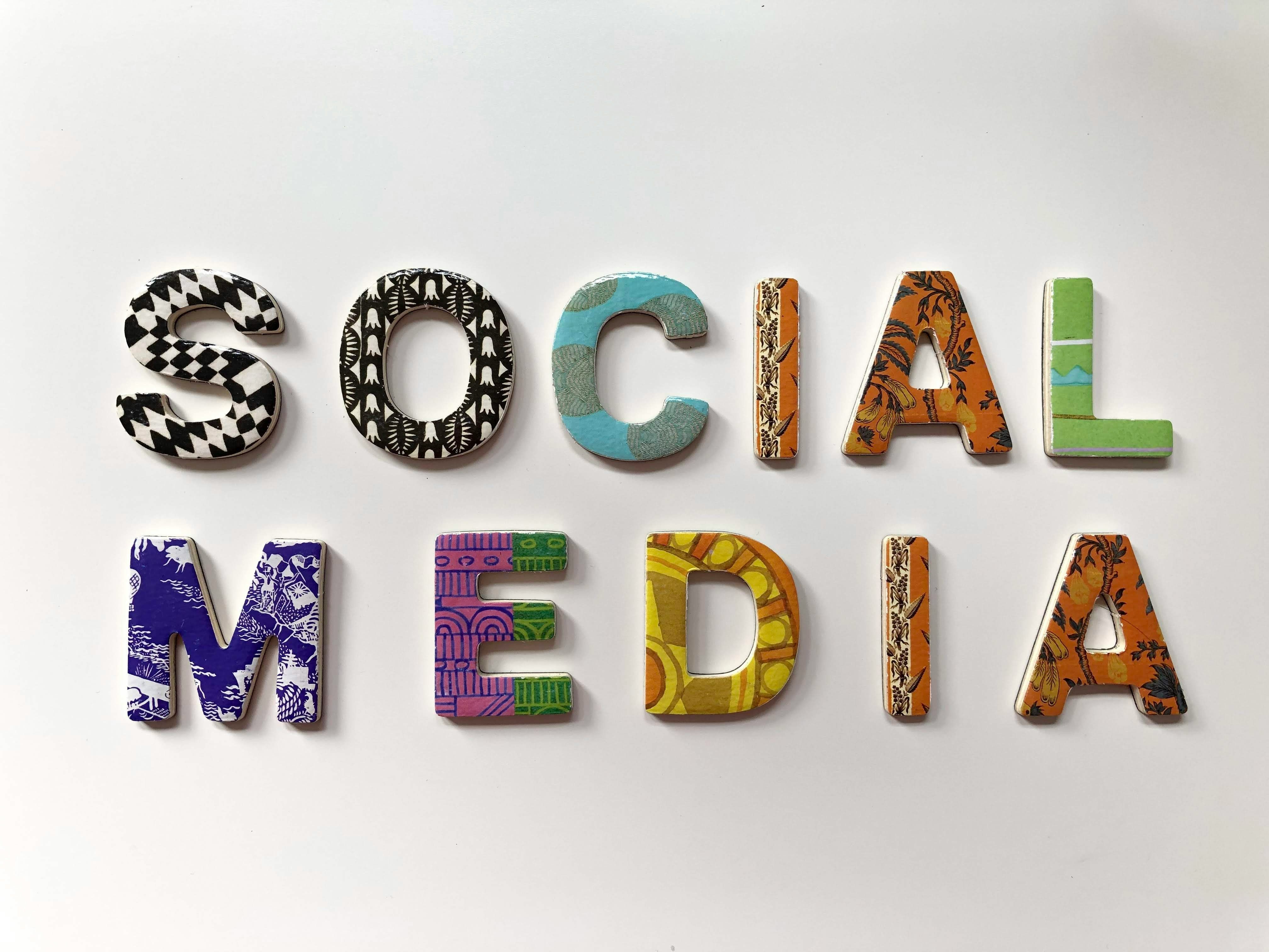 The words "Social Media" written in an assortment of colors and patterns