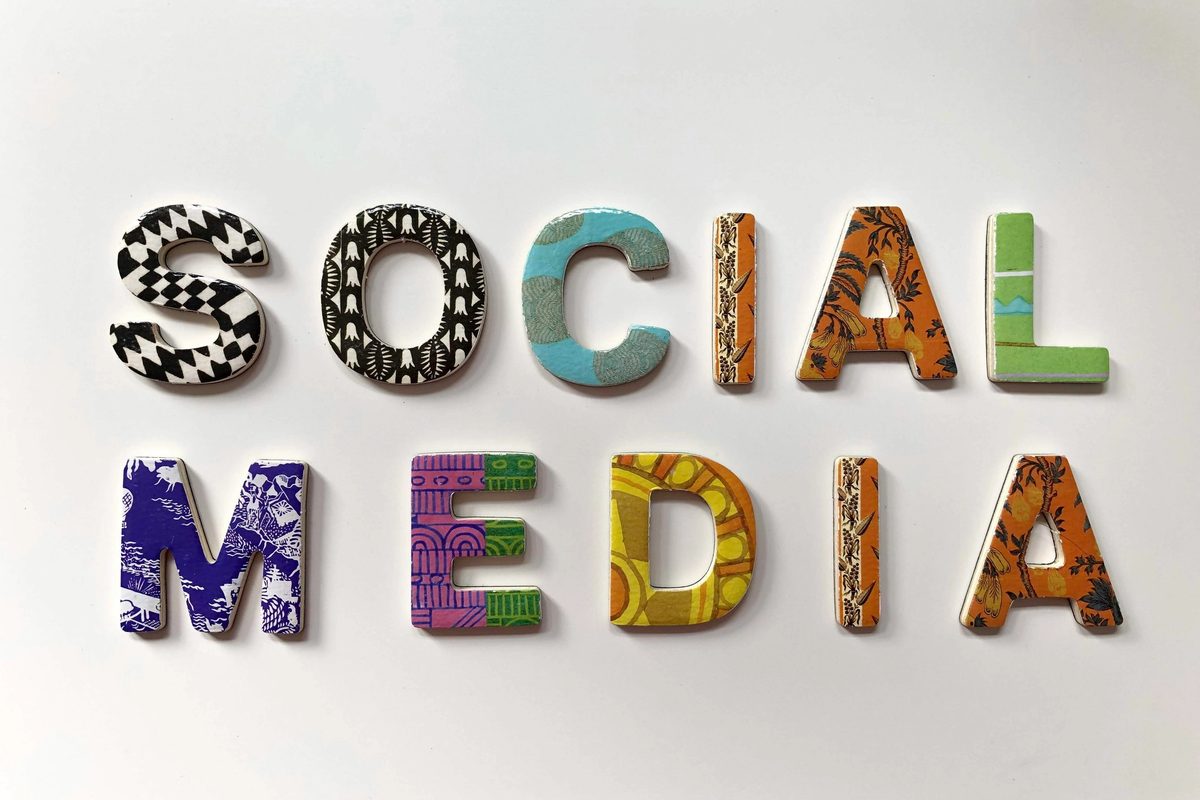 The words "Social Media" written in an assortment of colors and patterns