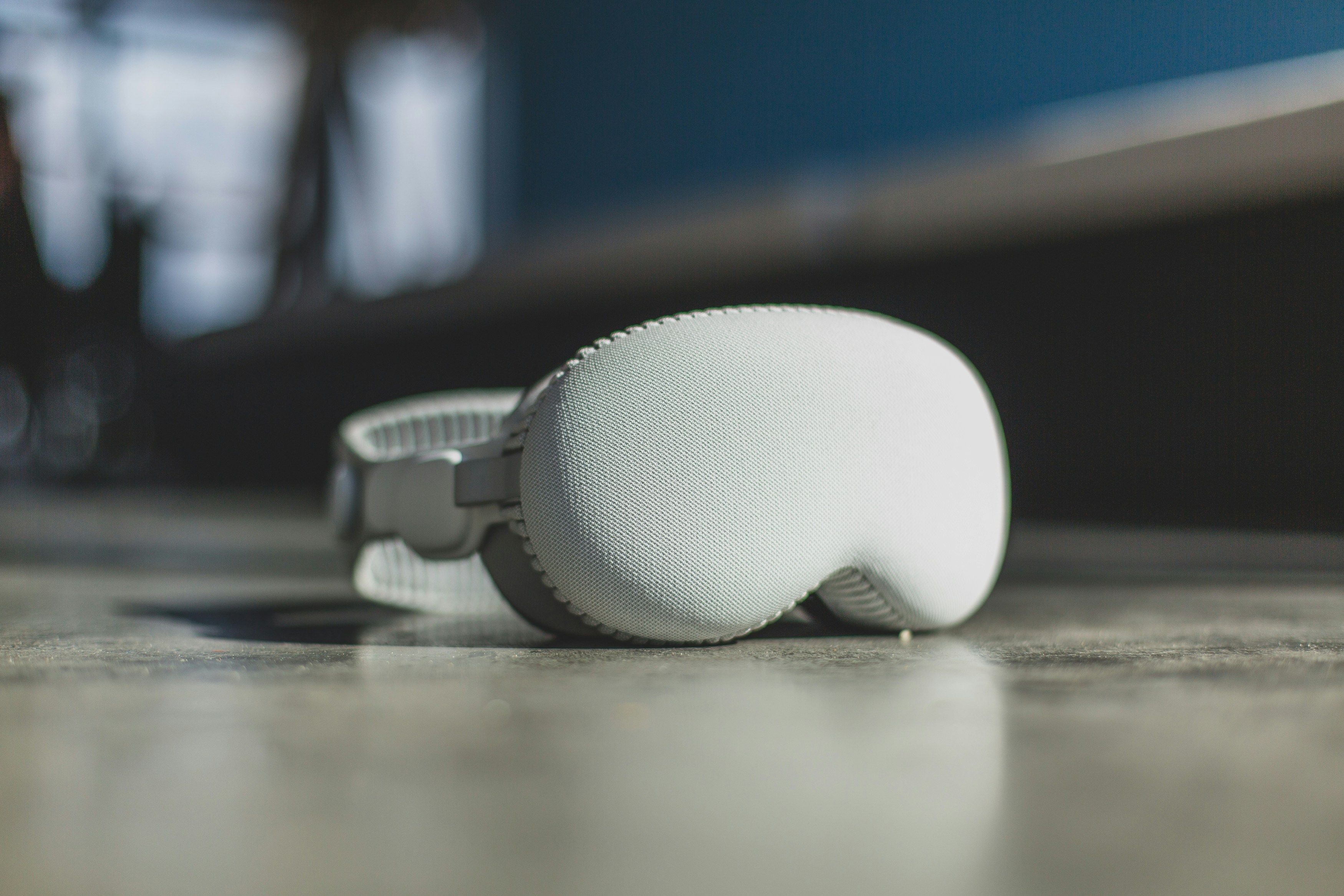 Apple Vision Pro headset on a concrete floor