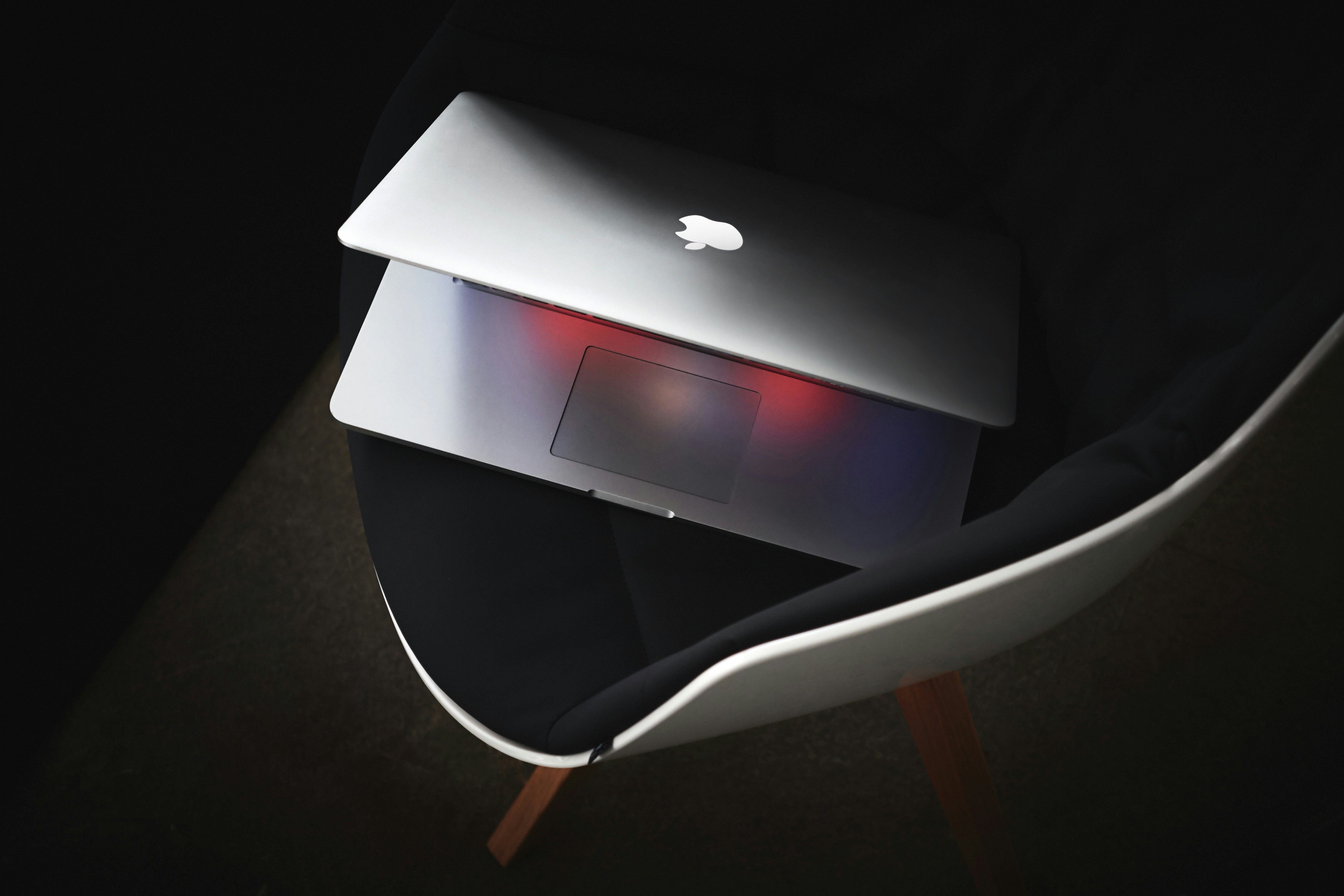 MacBook Pro on a black chair