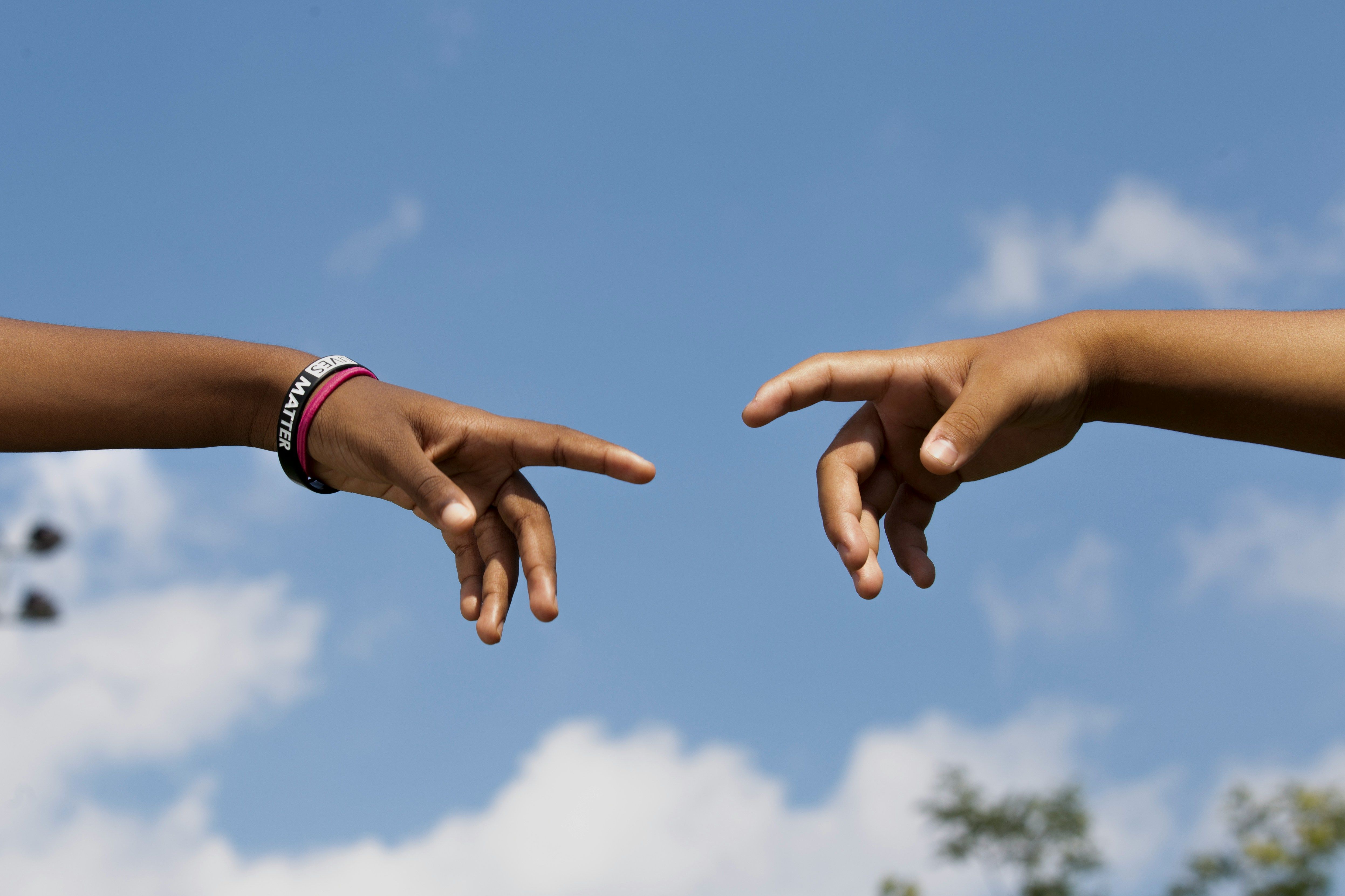 Two hands drawn to each other, indicating need for connection