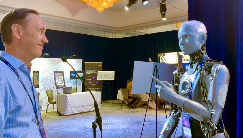 Man engaging a humanoid robot