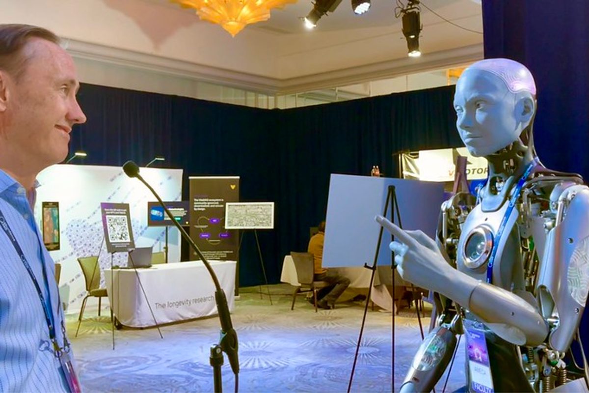 Man engaging a humanoid robot