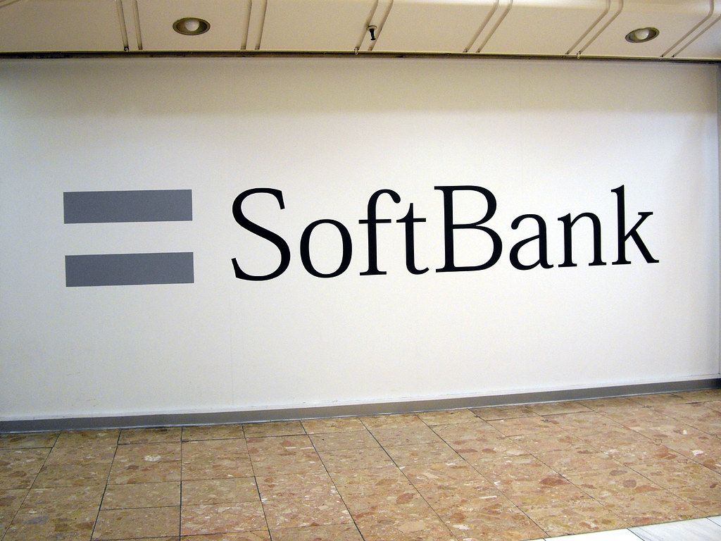 Main Image: "SoftBank" logo on a subway wall in Tokyo