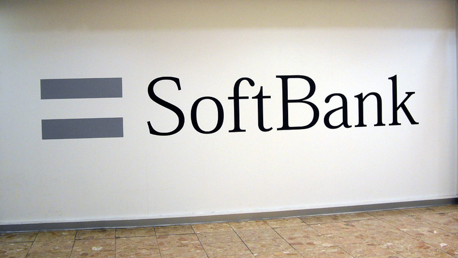 Main Image: "SoftBank" logo on a subway wall in Tokyo