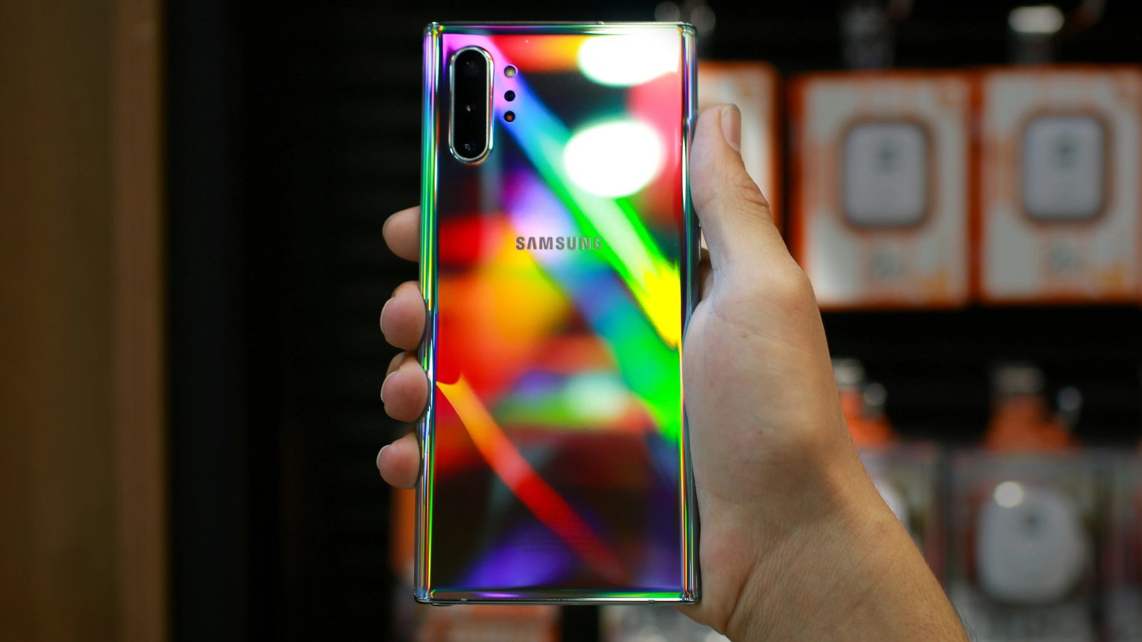 Main post image. Someone holding up a color splashed Samsung phone