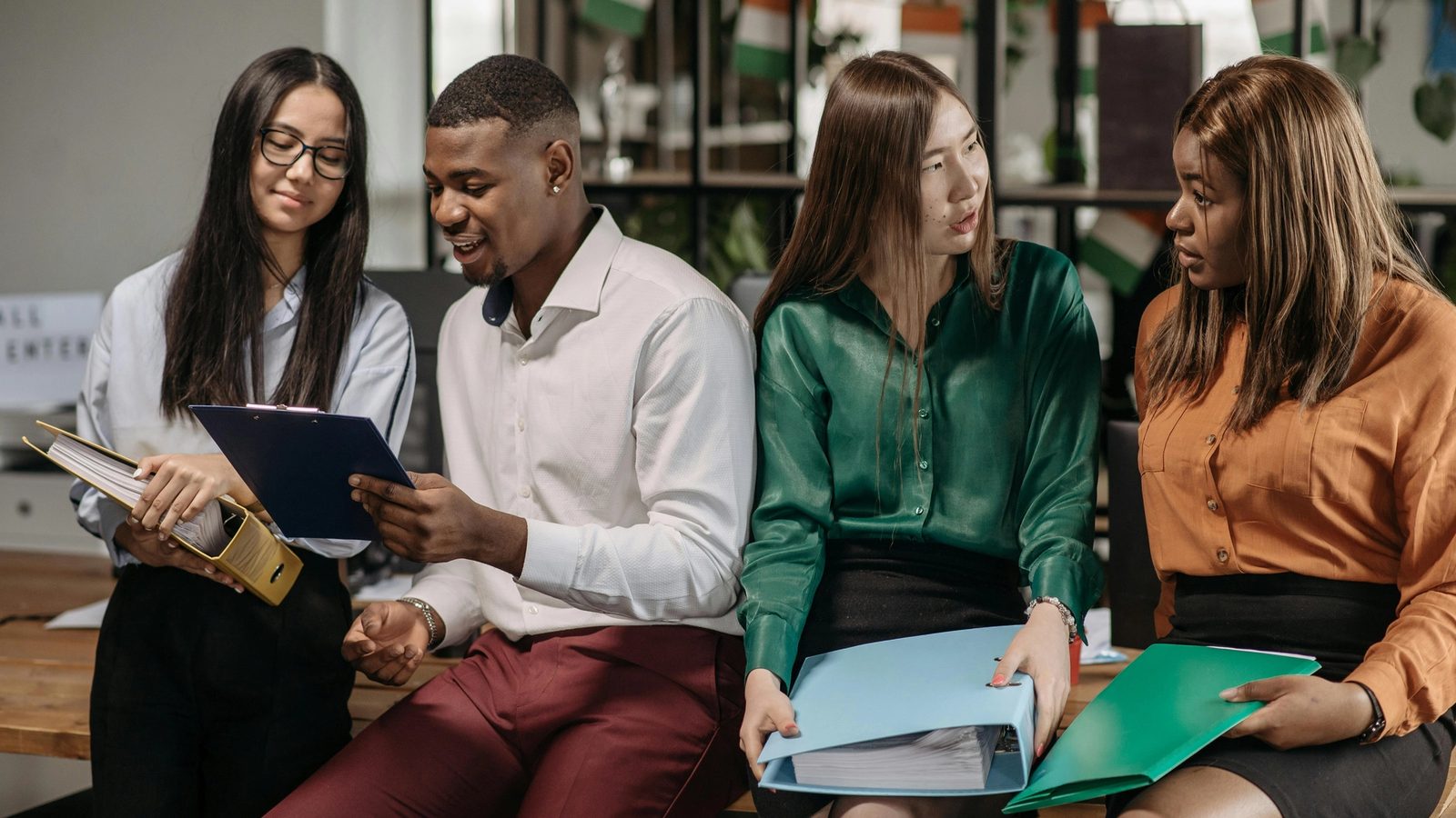 Main Image: Four people having a team meeting