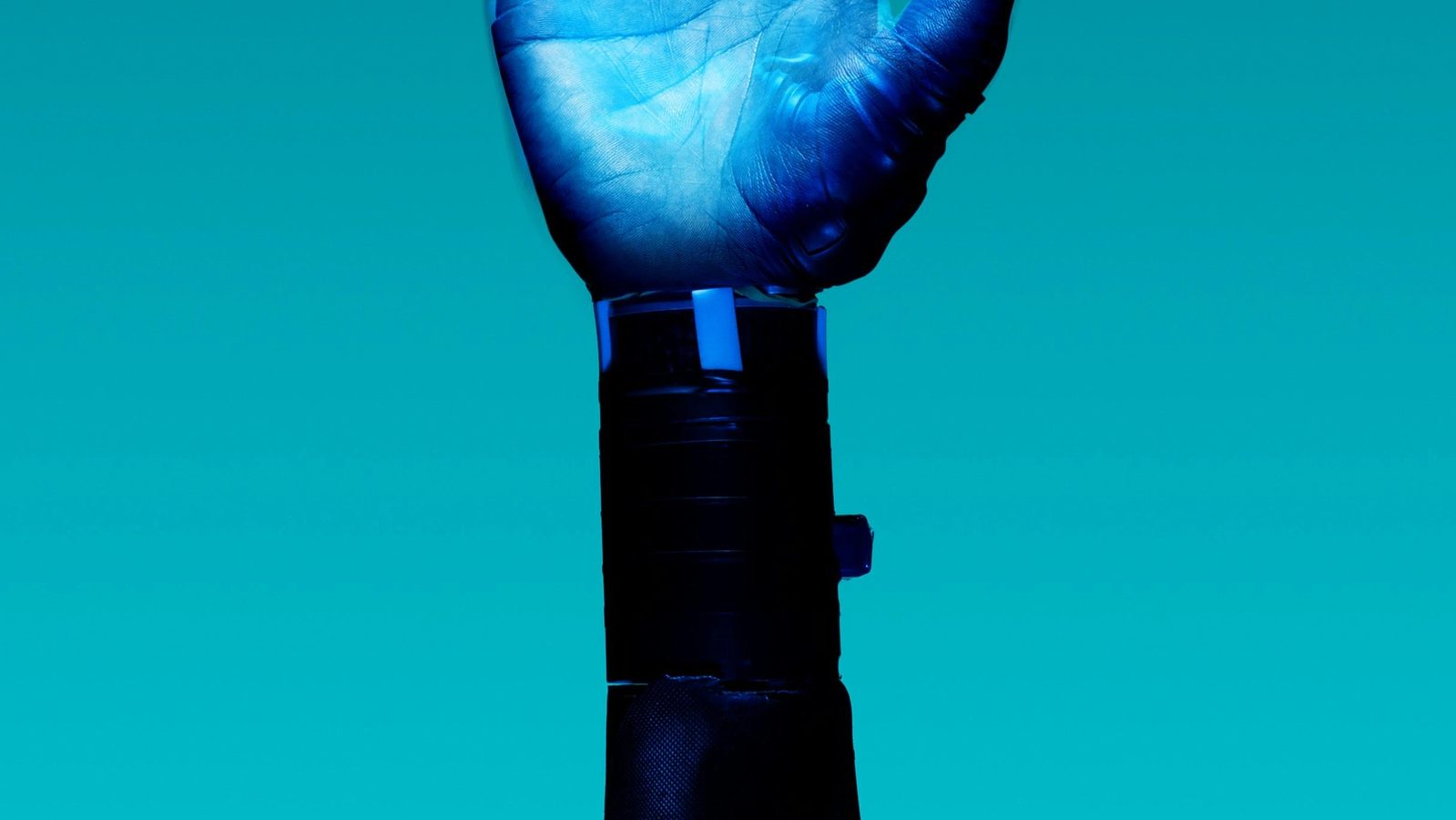 Main Image: prosthetic arm on blue background