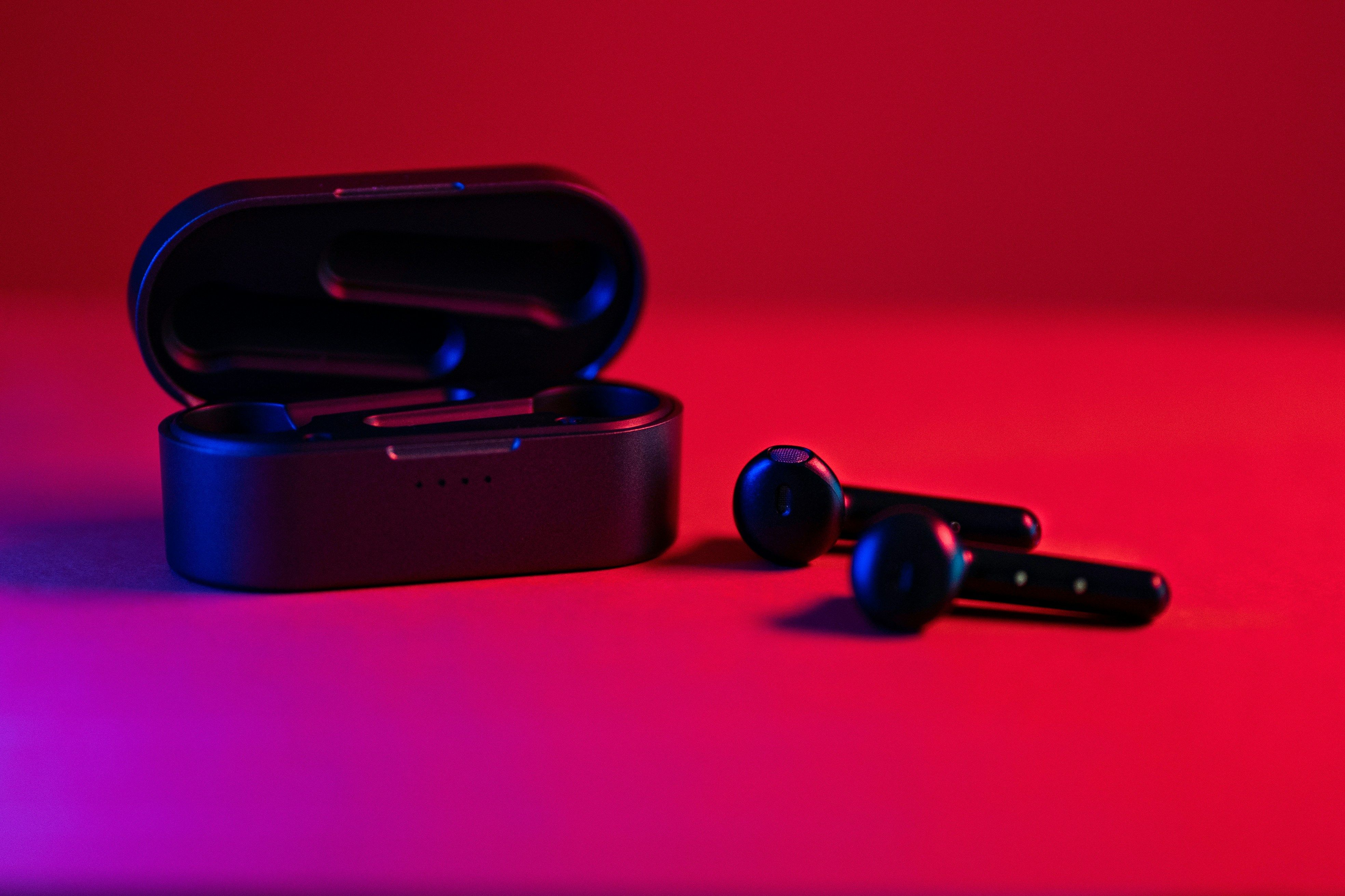 Main Image: Black and blue True Wireless earbuds