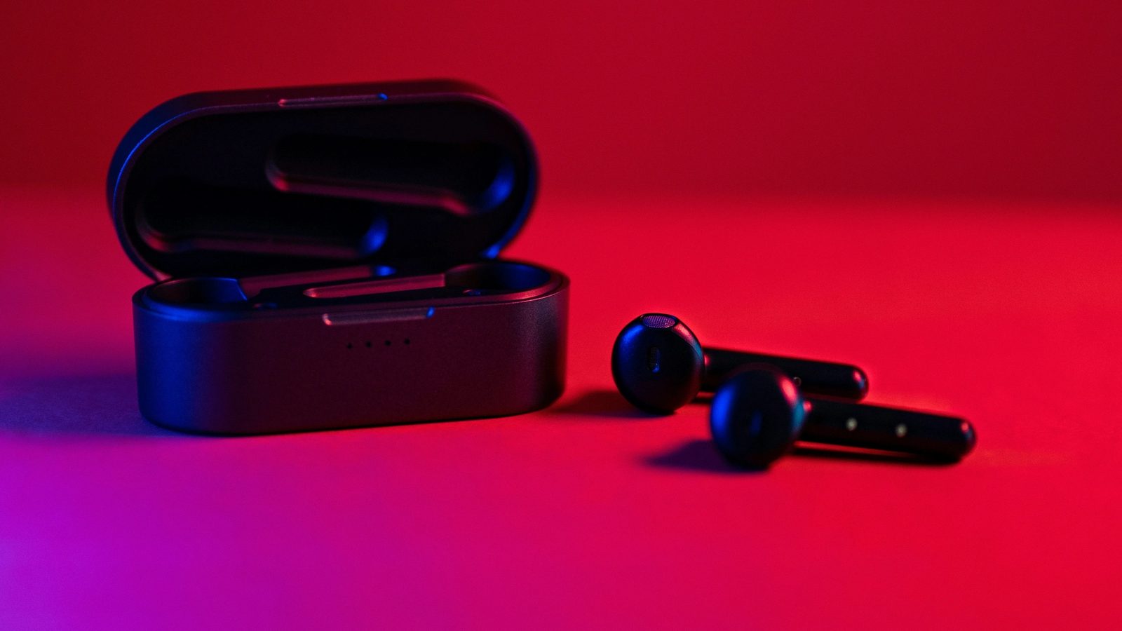 Main Image: Black and blue True Wireless earbuds