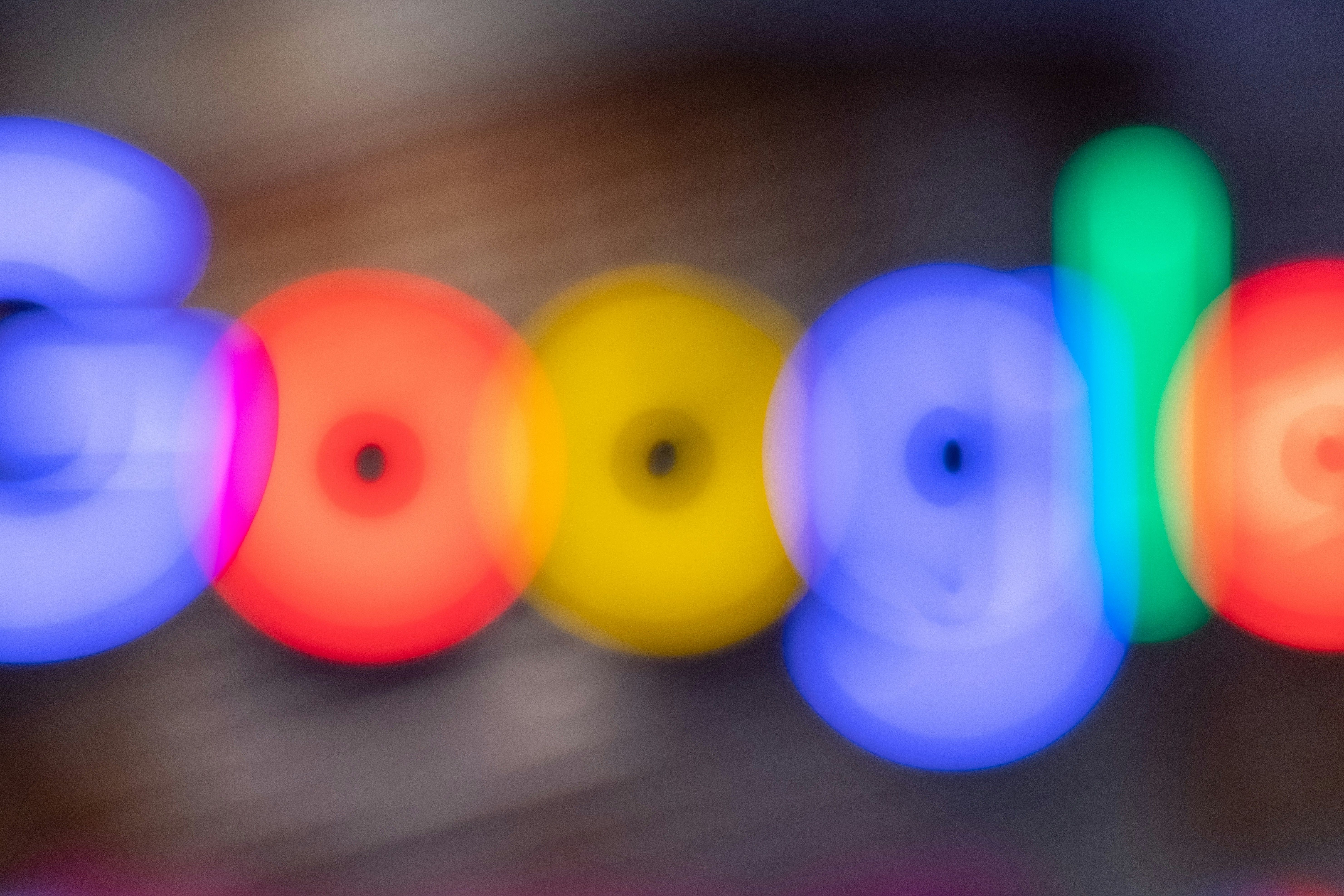 A blurry illustration of Google's logo. In several colors