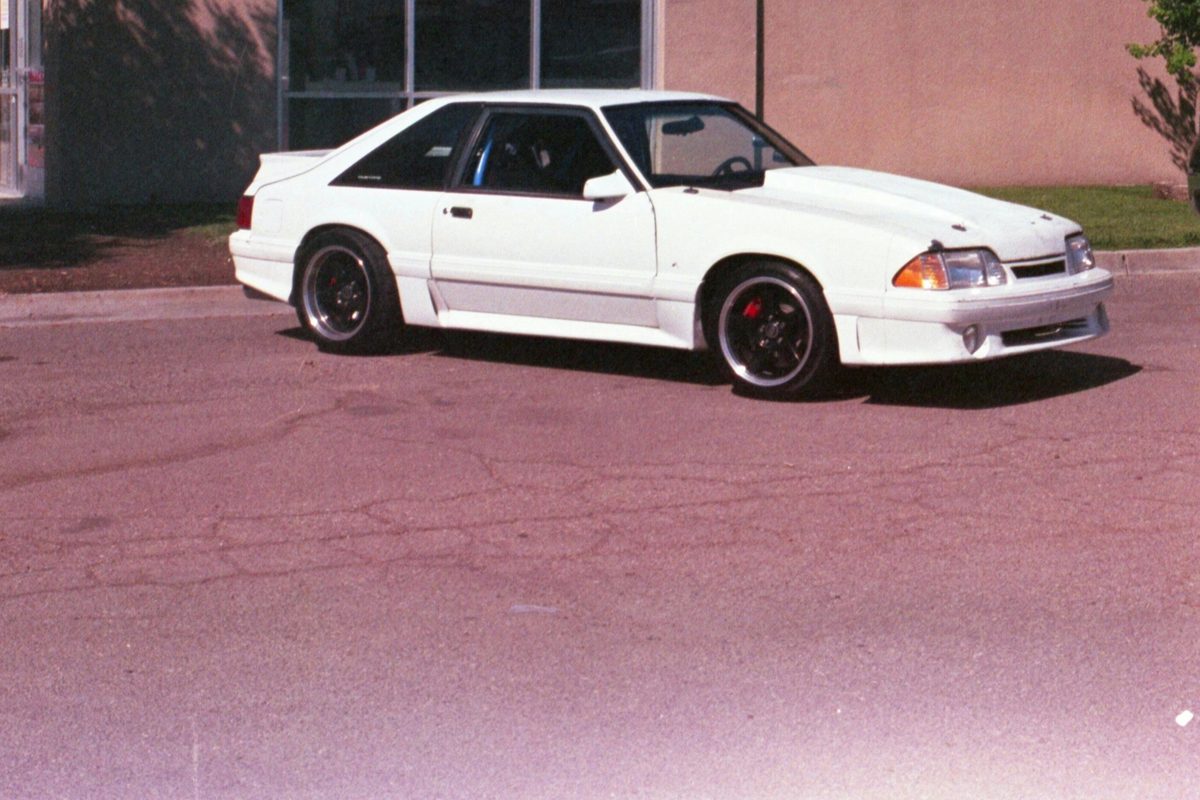 White car parked outside a T-Mobile retail store