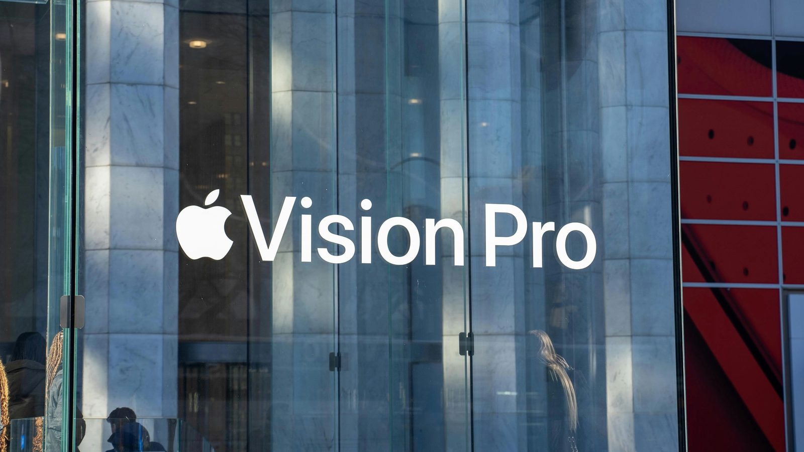 Main Image: Apple Vision Pro logo in the front of the Apple Store, in New York.