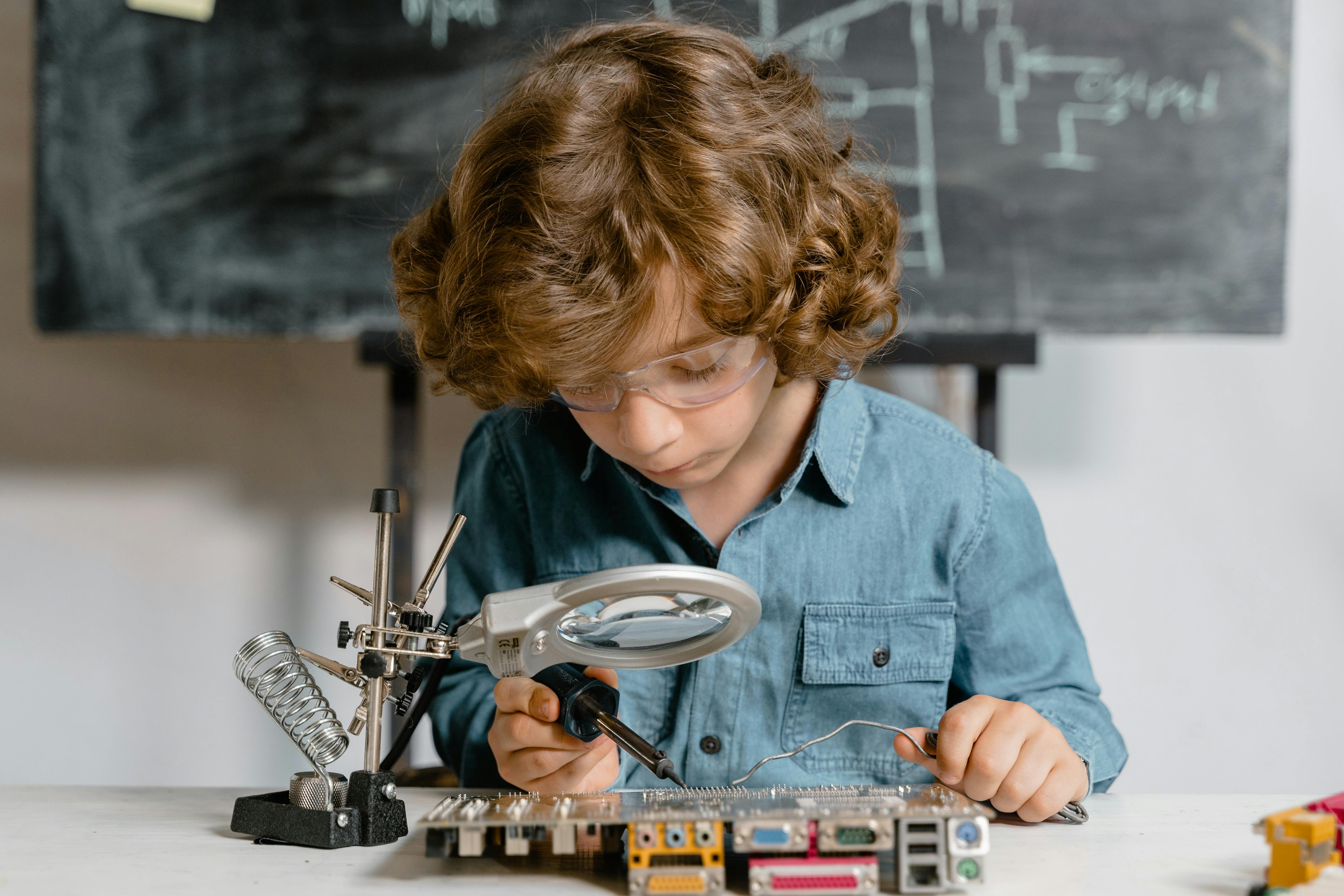 close up photo of a smart boy doing a science experiment