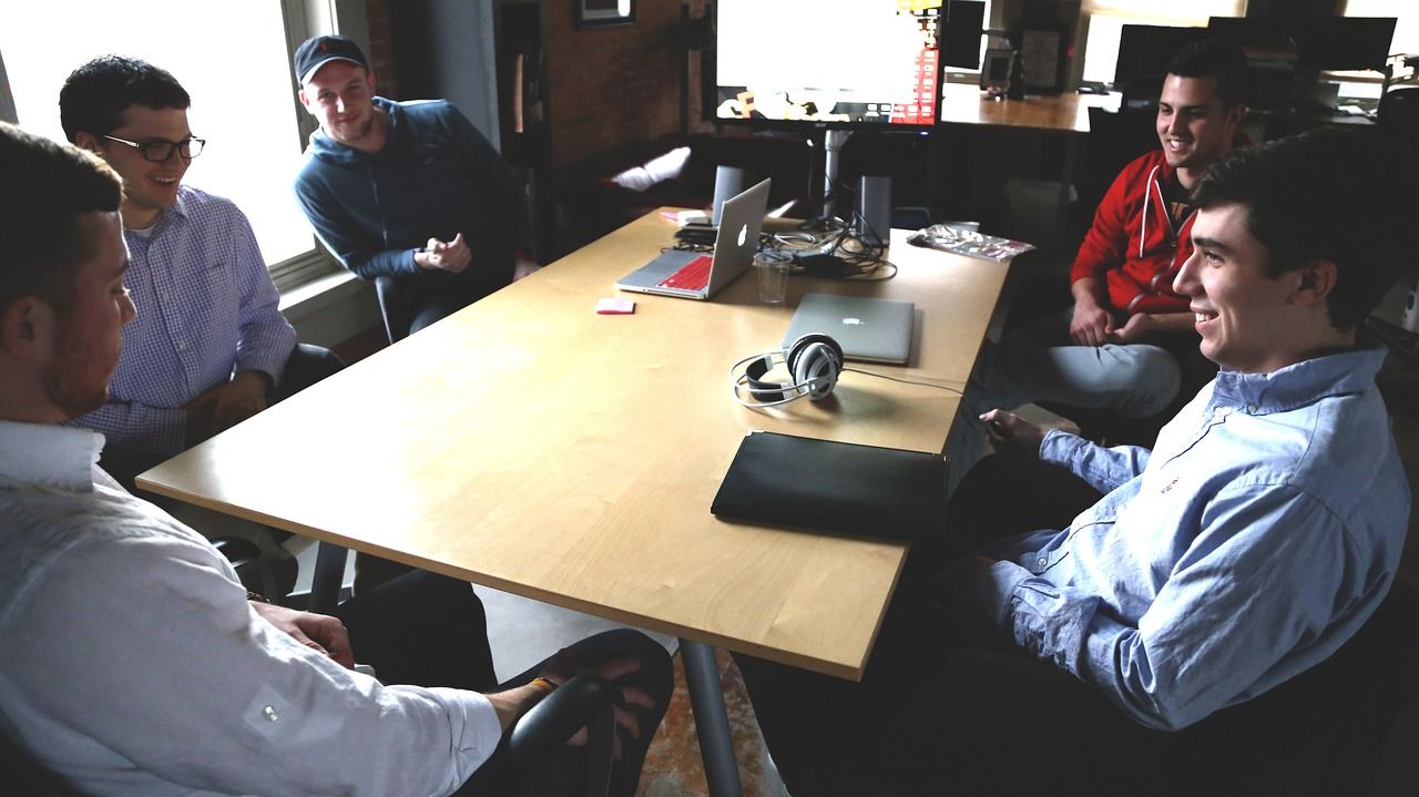 A startup team sat around a table at the office