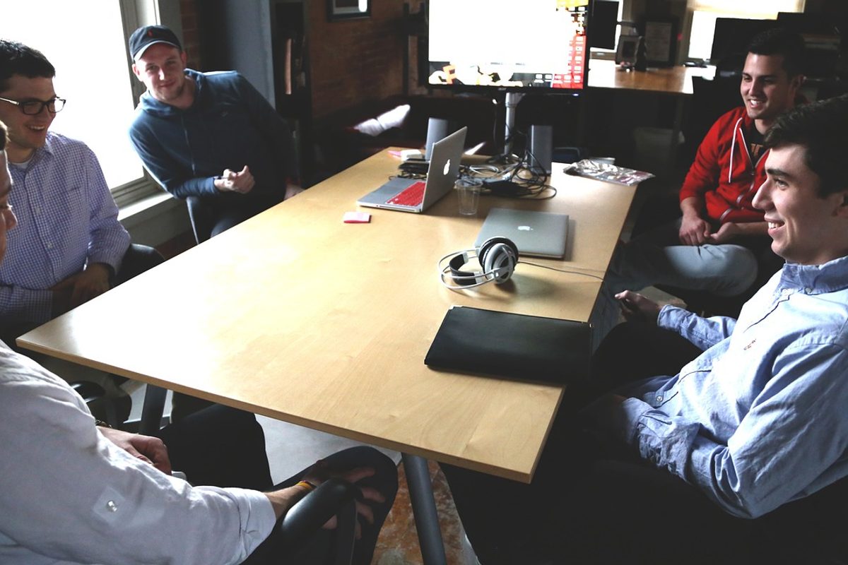 A startup team sat around a table at the office