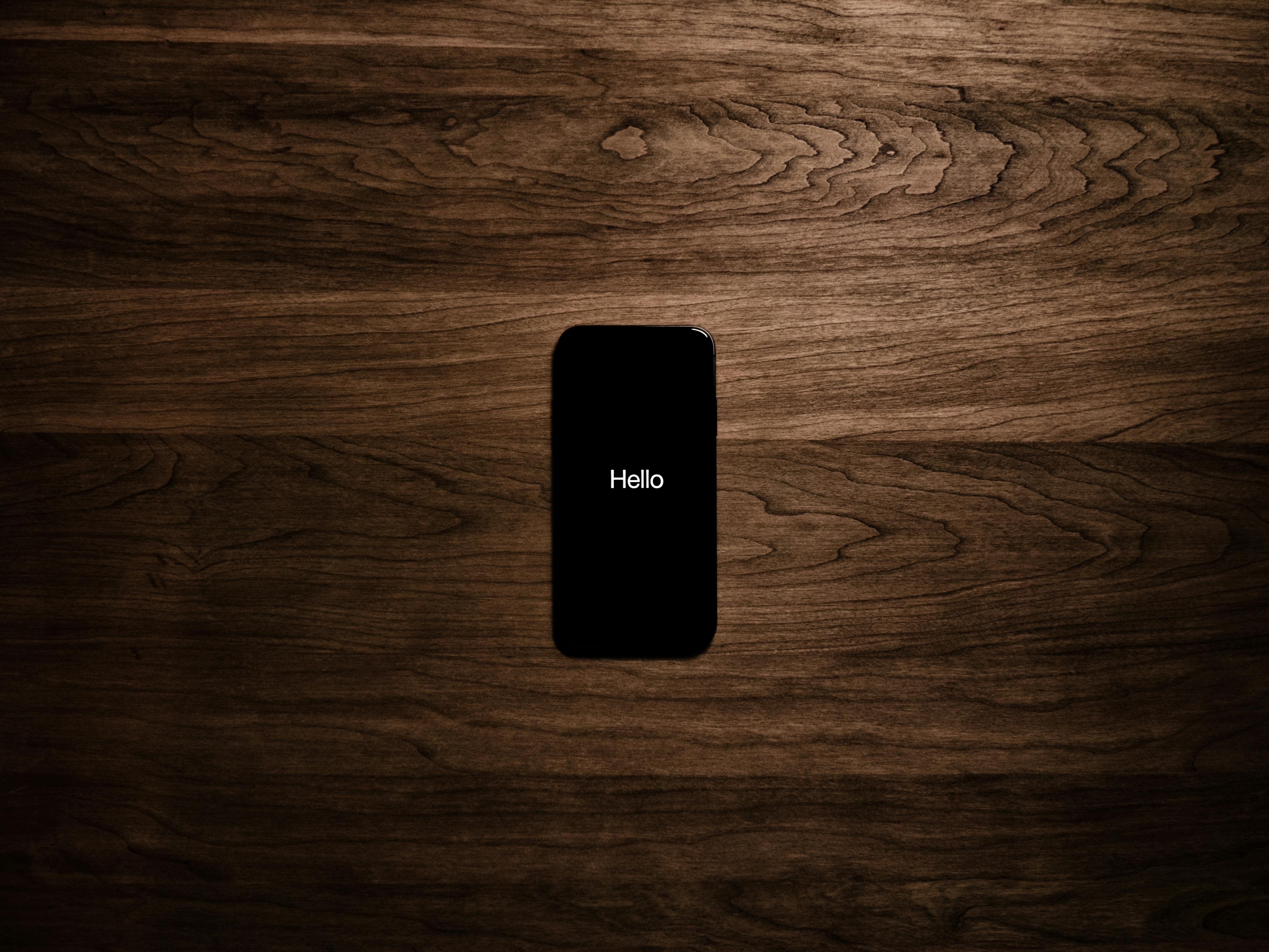 iPhone 7 displaying "Hello"