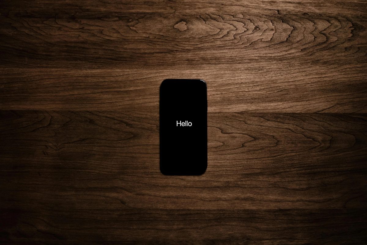 iPhone 7 displaying "Hello"