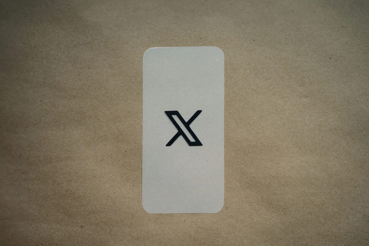 A photo of a sticker containing the X icon
